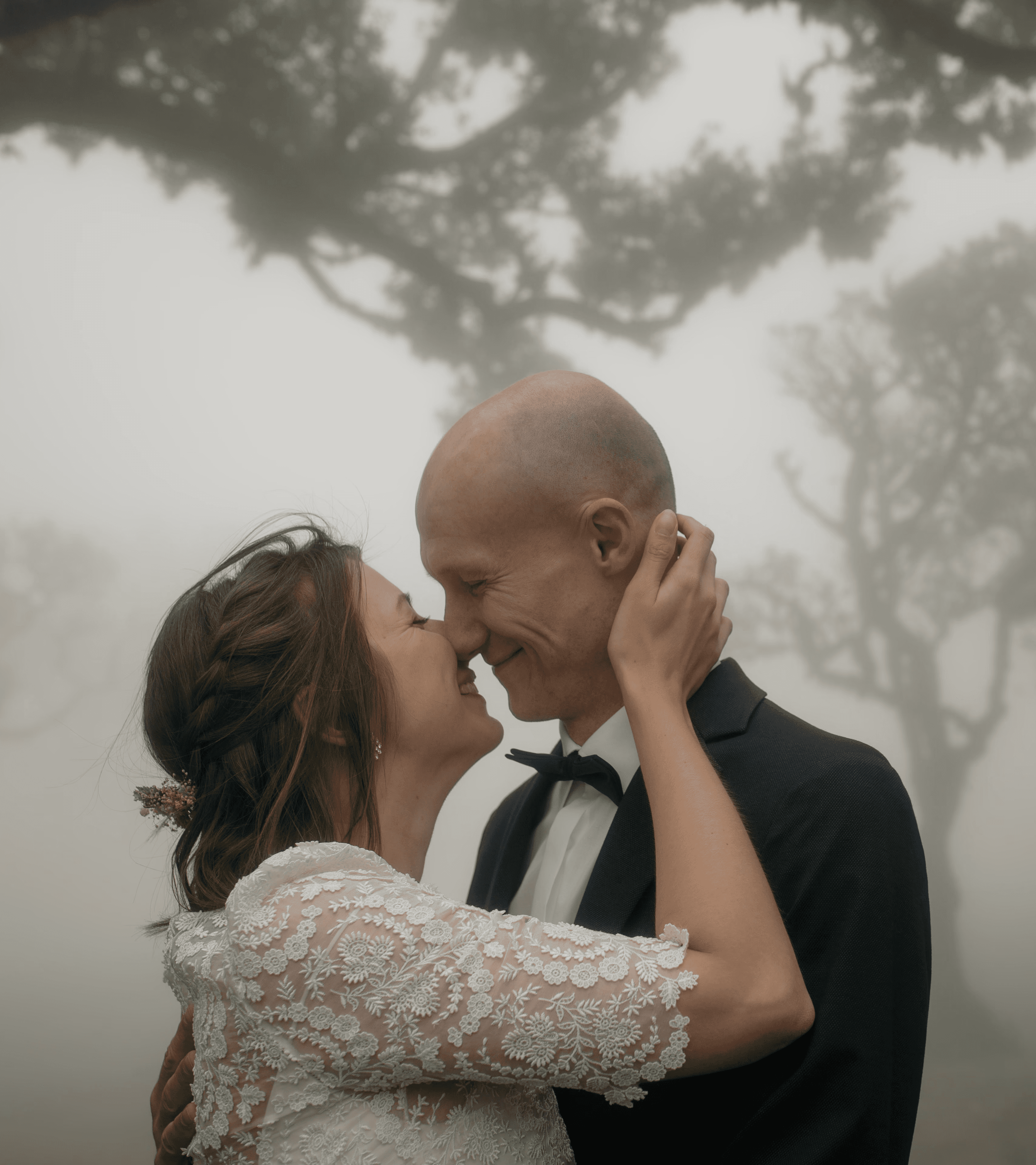 happy couple sharing kiss after their elopement ceremony in fanal forest