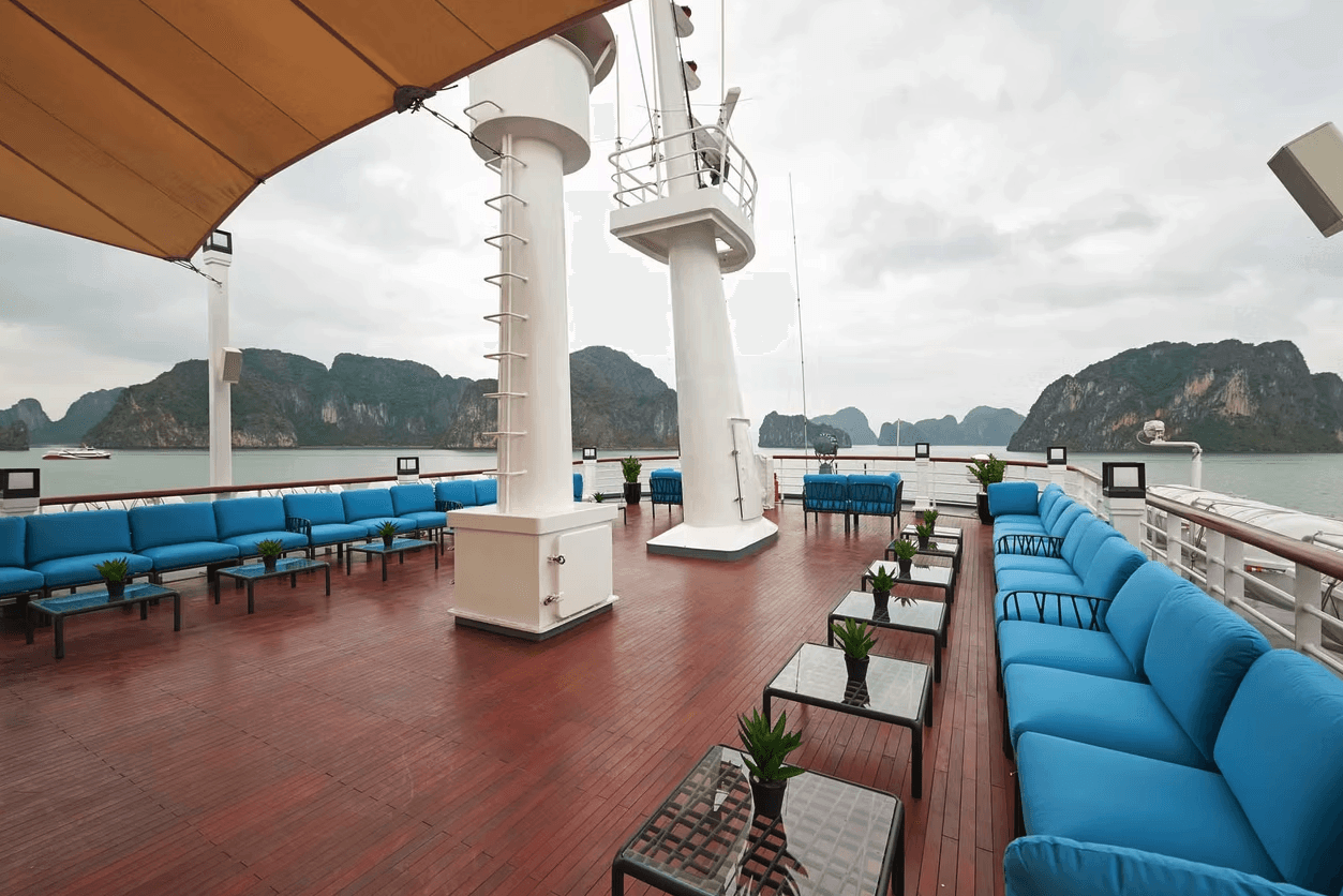 a room with a table, chairs, and a partition