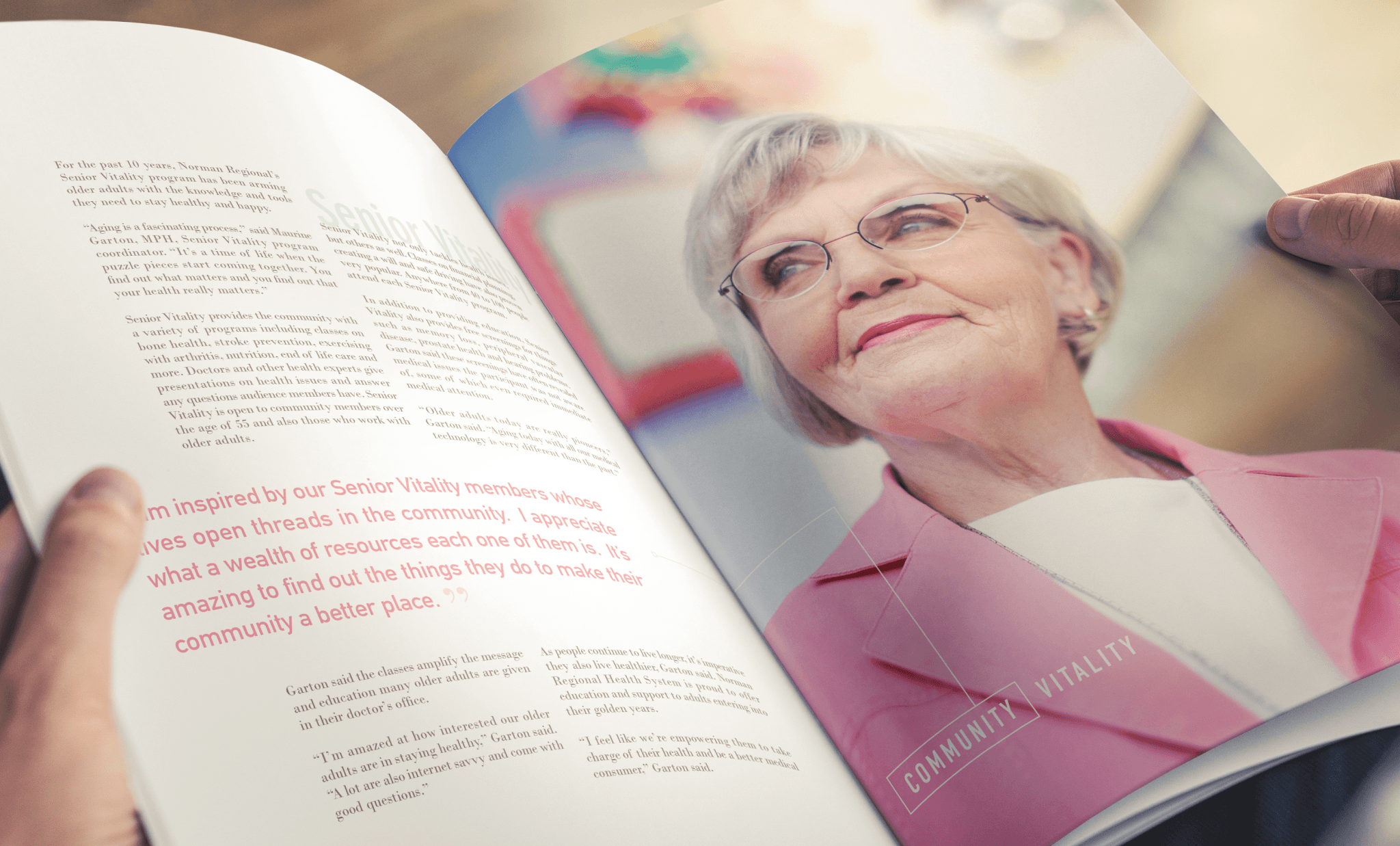 Pages of a book with an image of an older caucasian woman with gray hair, glasses, and pink blazer.