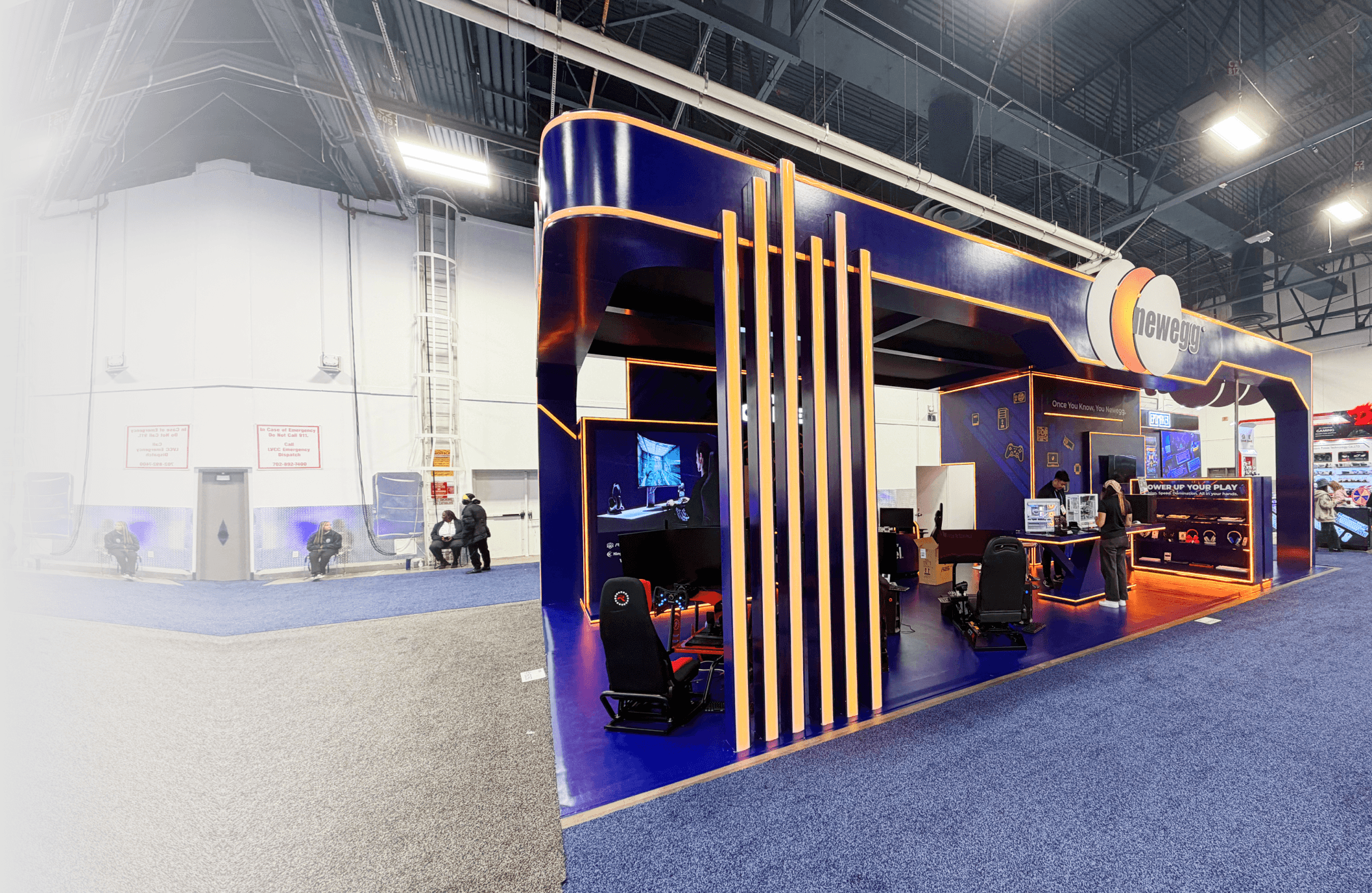 Custom island trade show booth with suspended circular structure engineered and installed at Las Vegas Convention Center (LVCC), demonstrating on-site execution and structural coordination.
