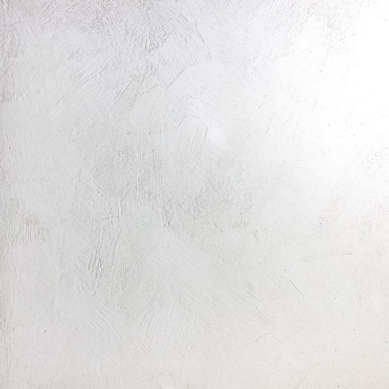 Lime wash pain on a wall to show the texture of the paint it's a white paint