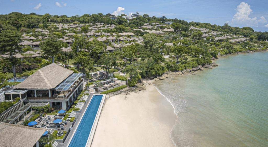 Aerial shot of a luxury beach resort near Jimbaran bay beach for real estate investment.