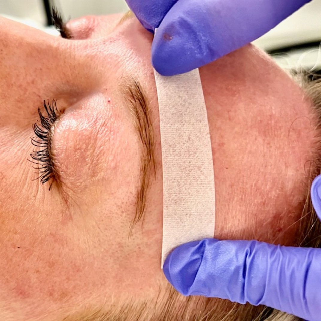 Woman getting her eyebrows done