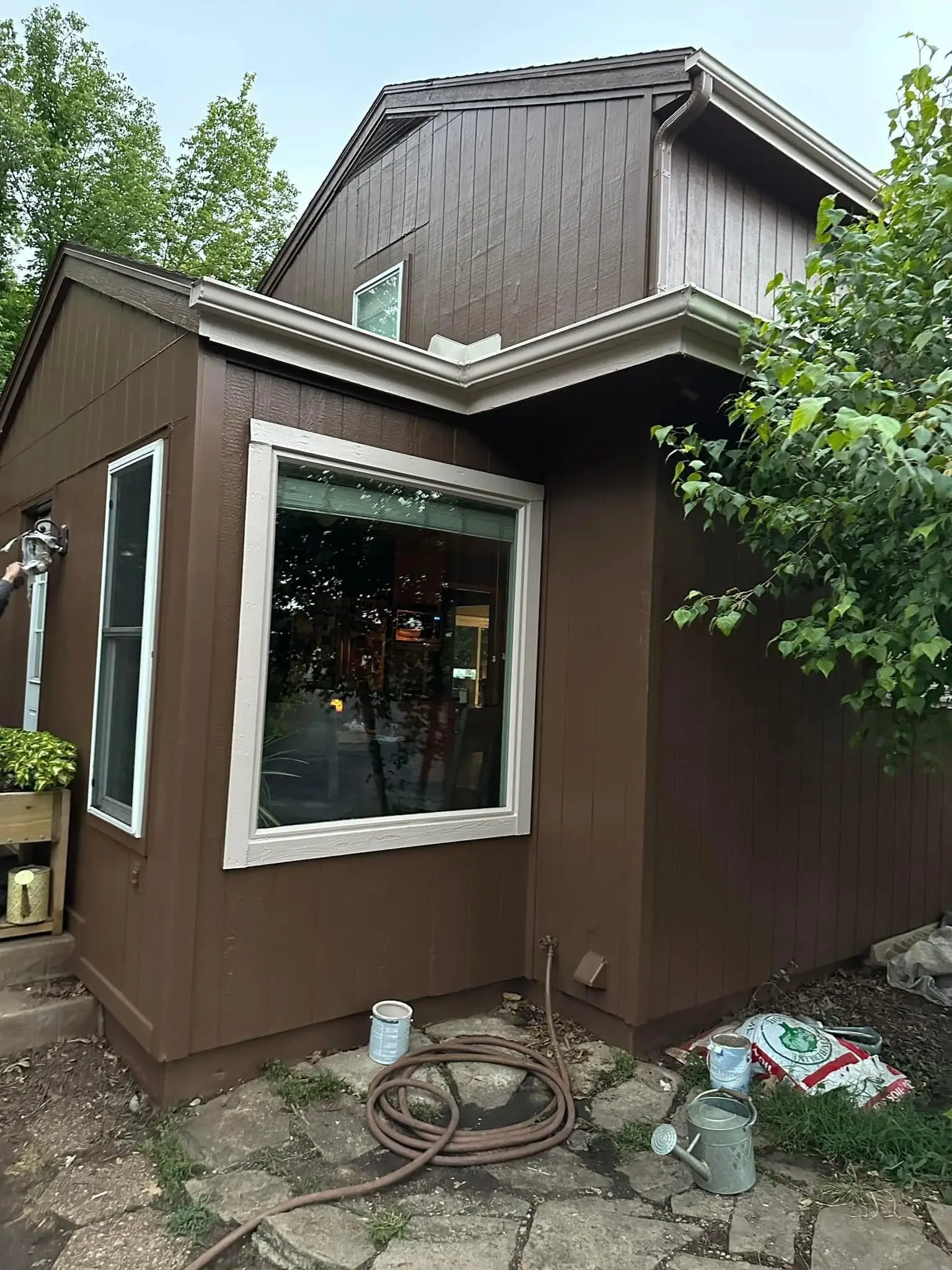 An image of a brown house showing newly repaired wood rot.