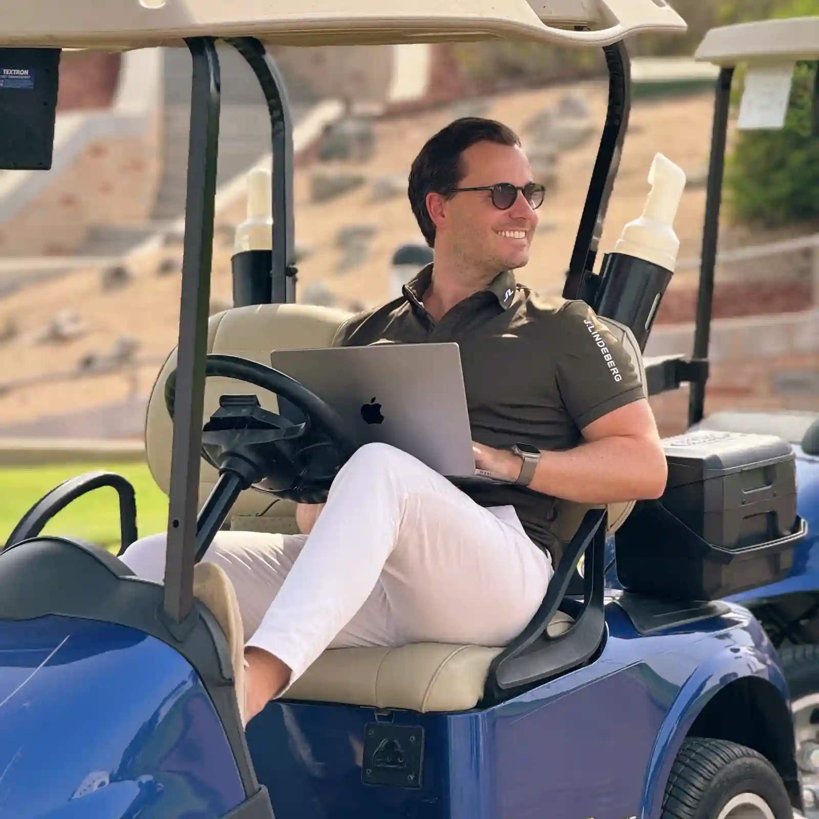 timothy-in-golf-buggy-with-laptop
