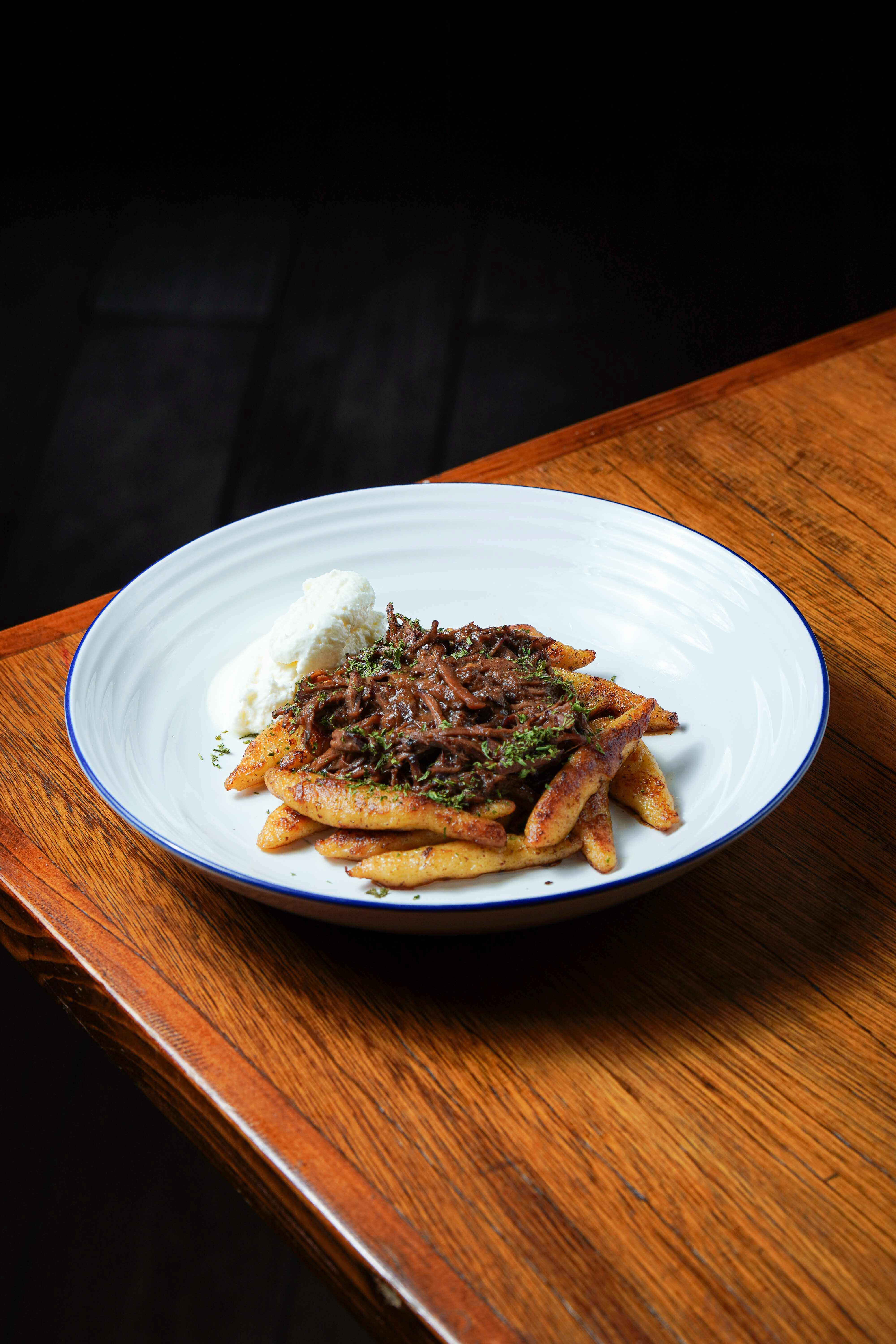 a cocktail glass with a cherry