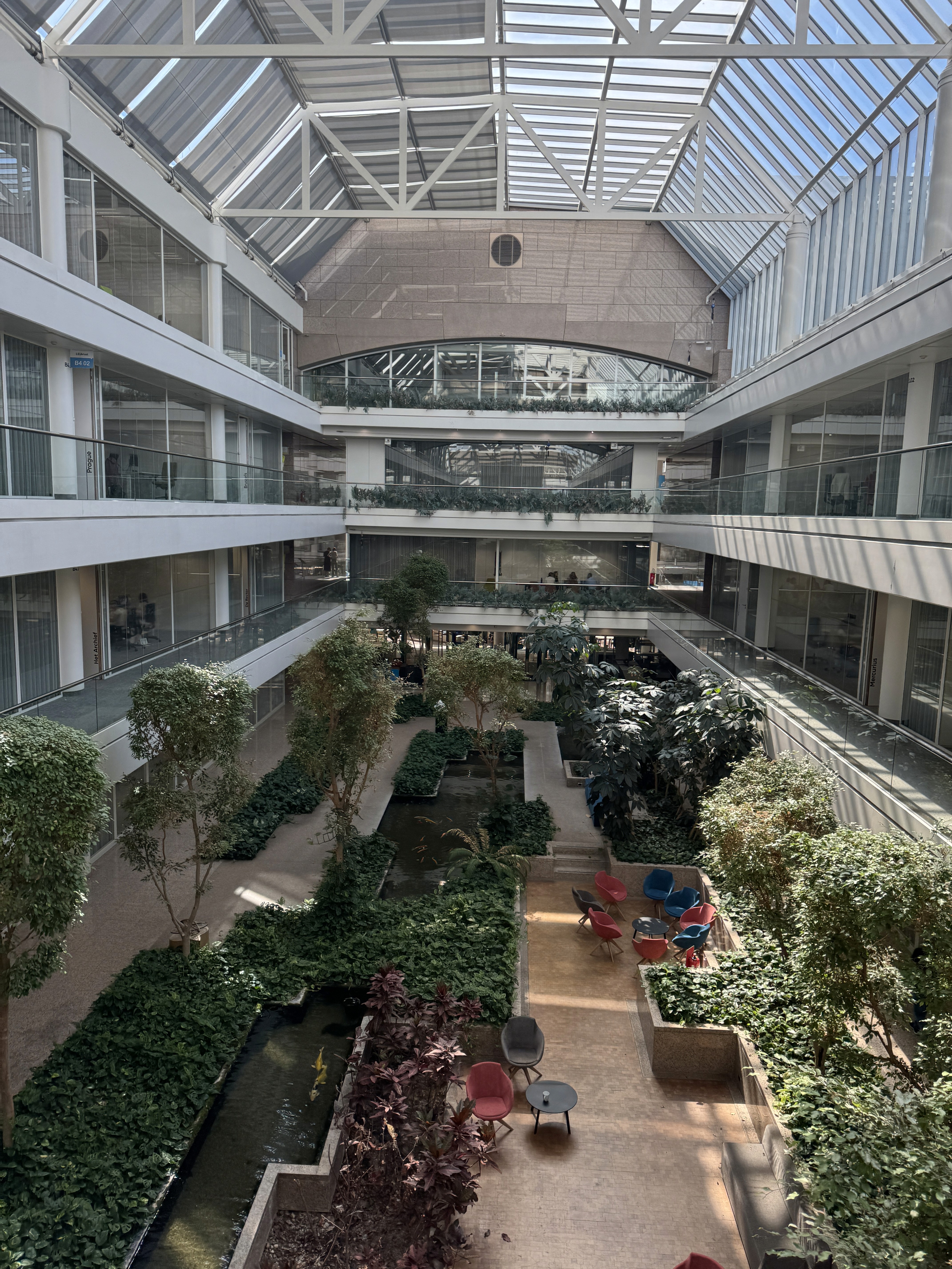 Person sitting on a ledge overlooking New York City skyline
