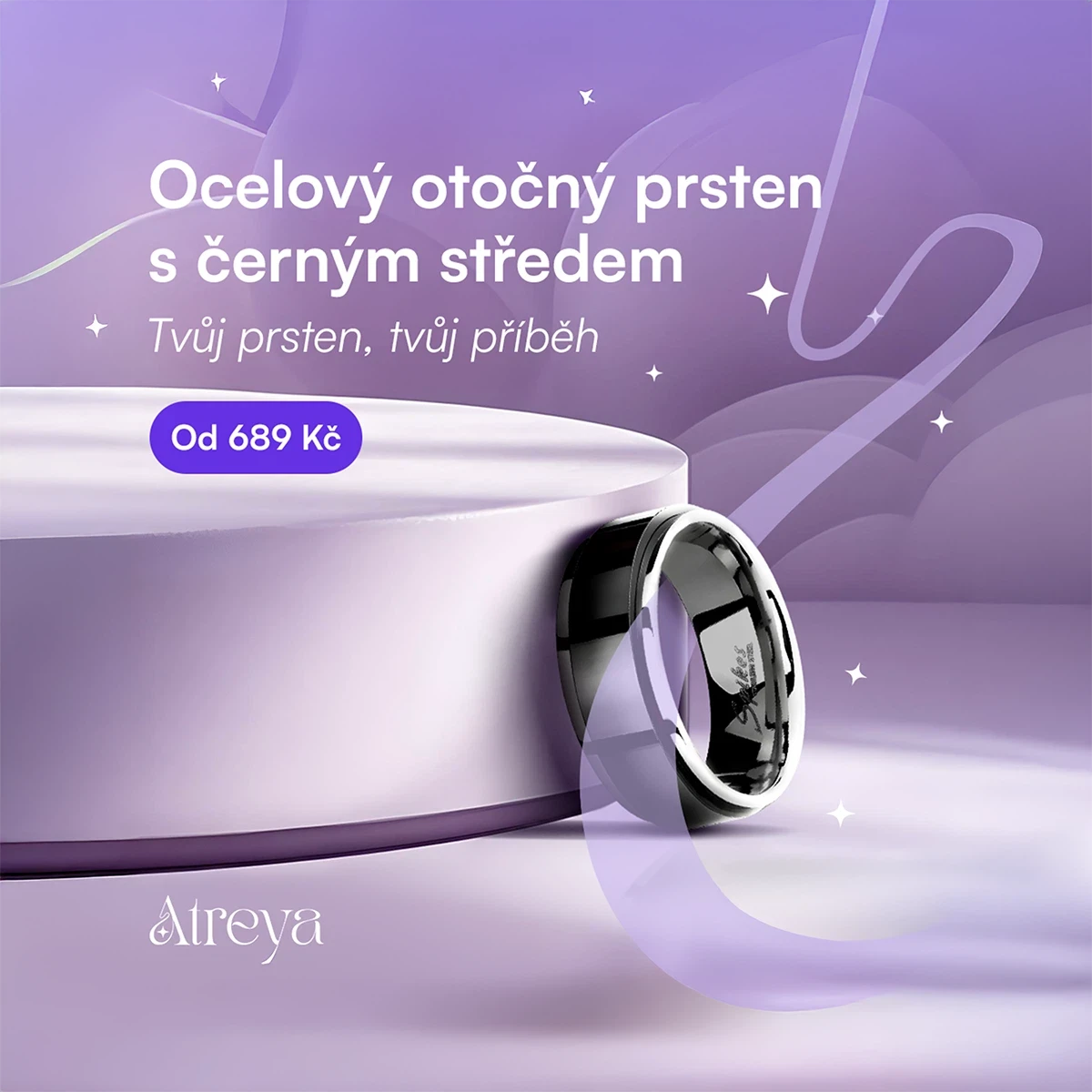 A steel rotating ring with a black center on a soft purple pedestal.