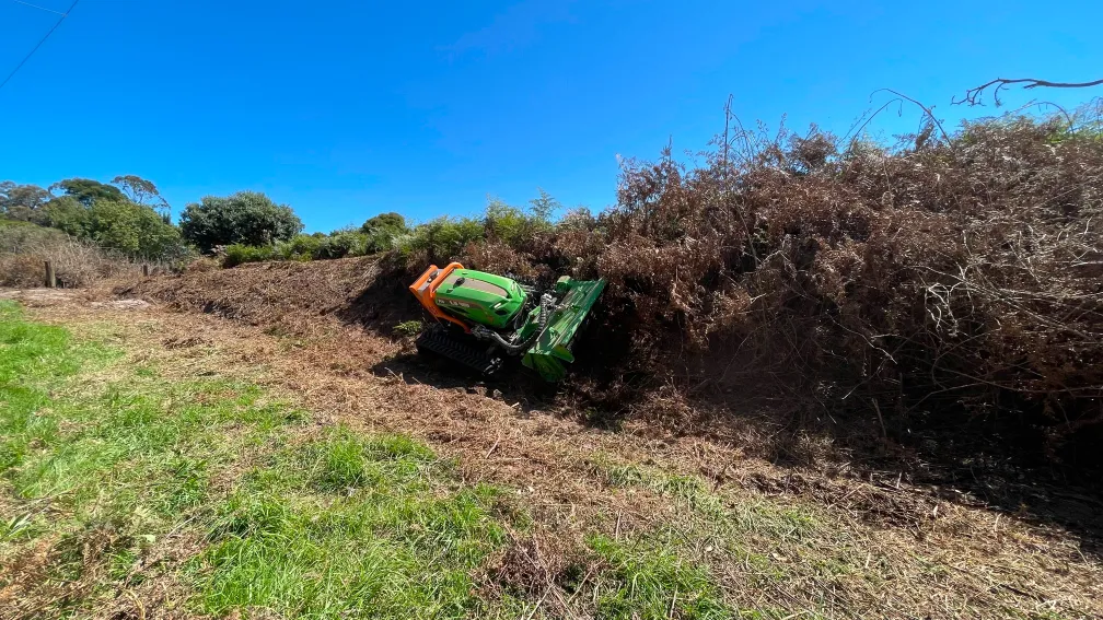 Clearing dangerous fire hazards on sloped terrain