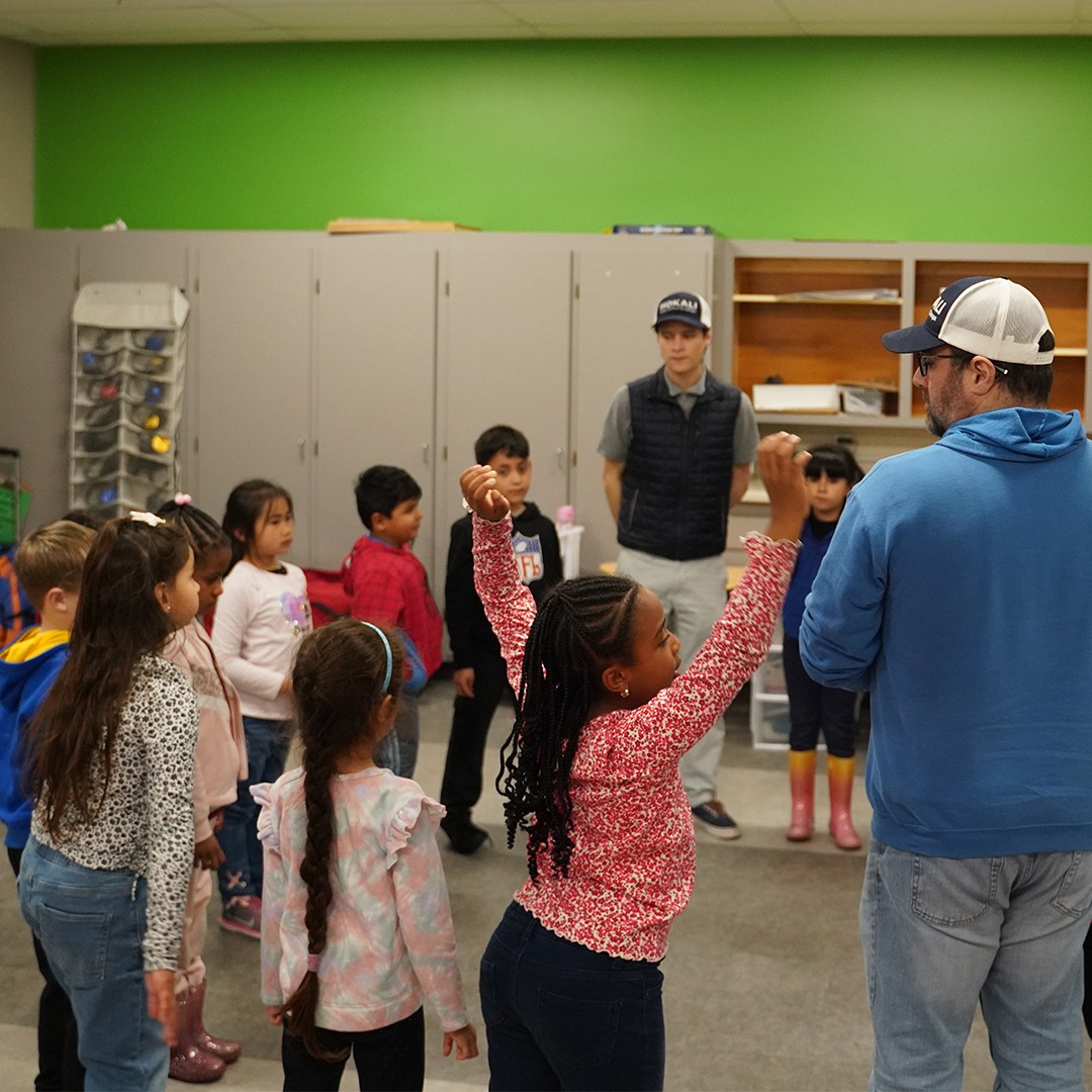 HOKALI educator facilitating a collaborative classroom activity that promotes participation and student confidence.