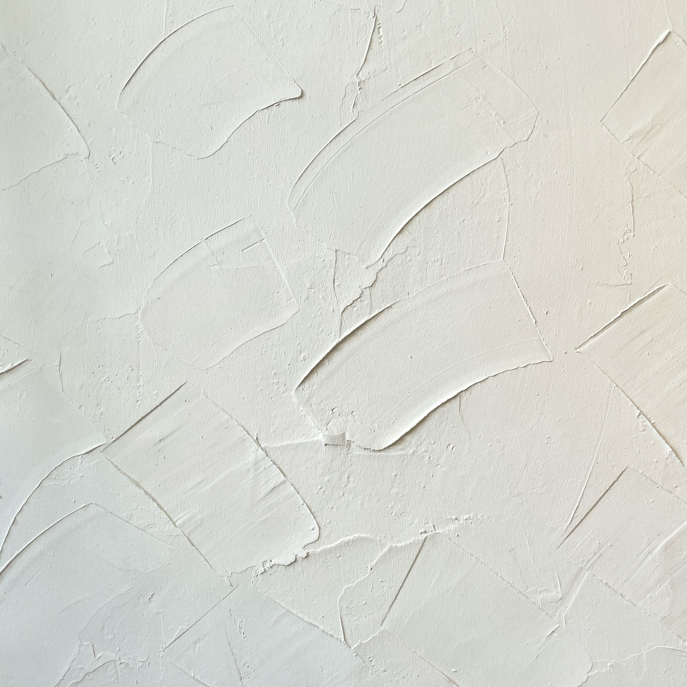 Hand-troweled lime plaster with soft, sweeping strokes