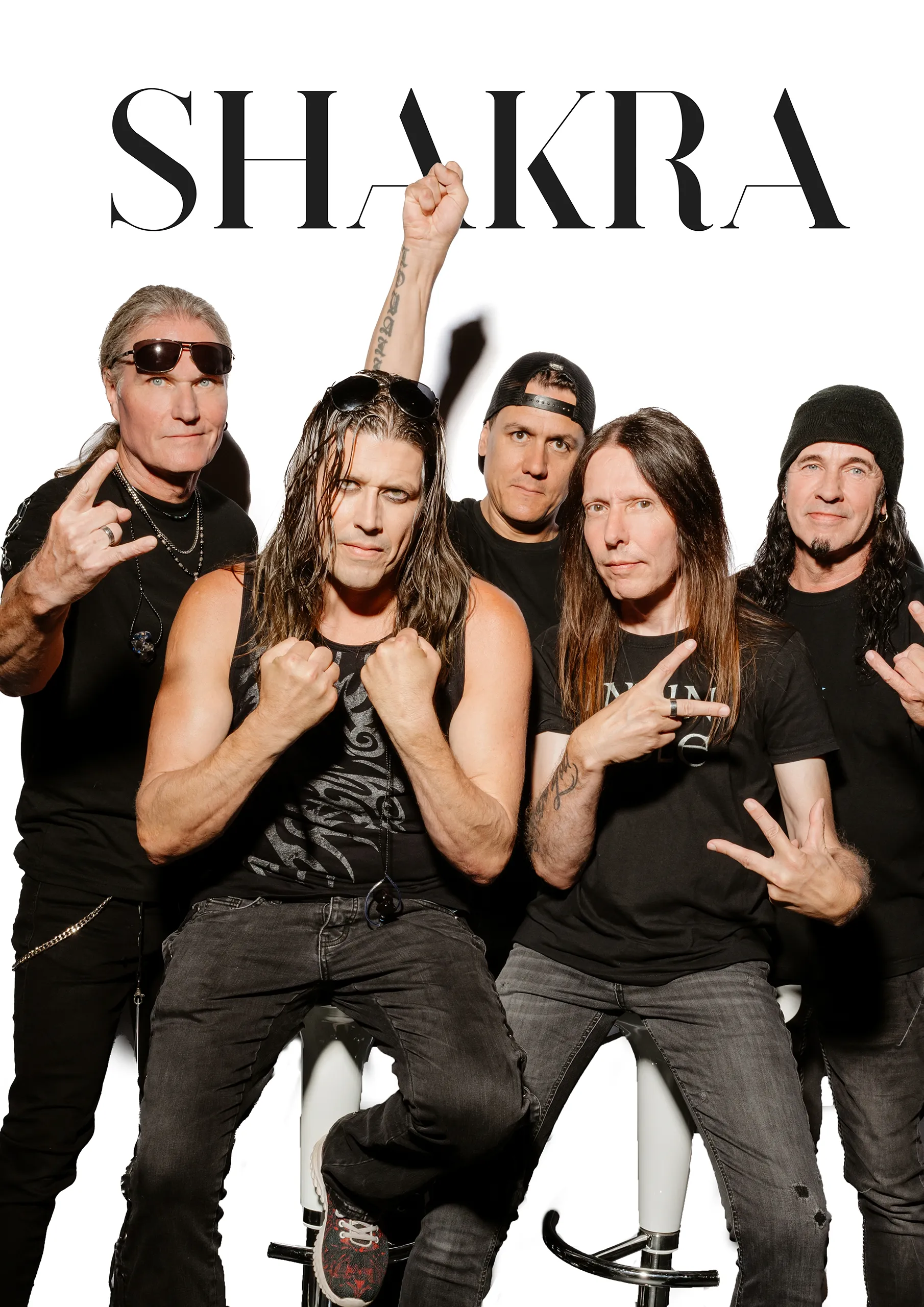 A group portrait of the rock band Shakra posing together.