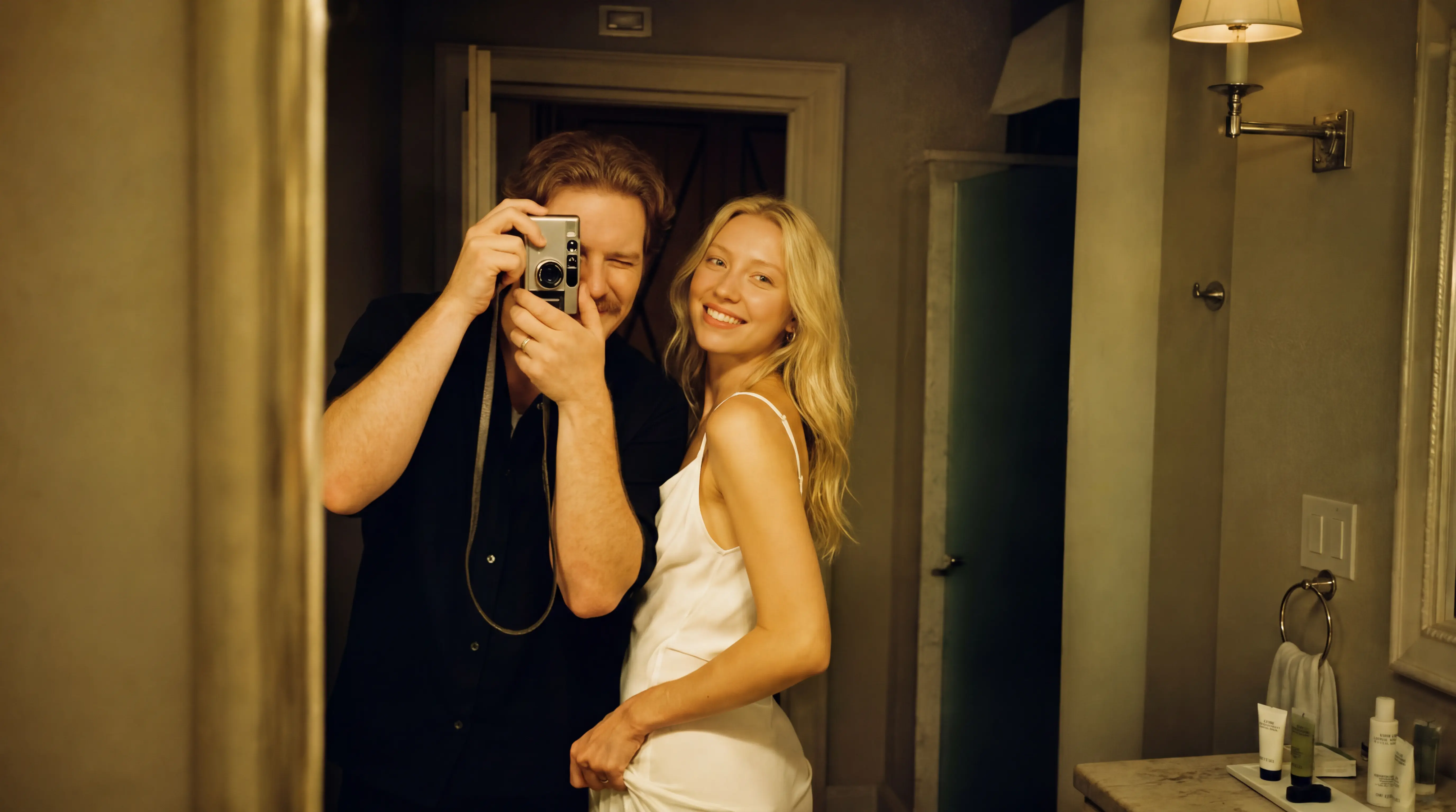 Couple taking a photo in the mirror