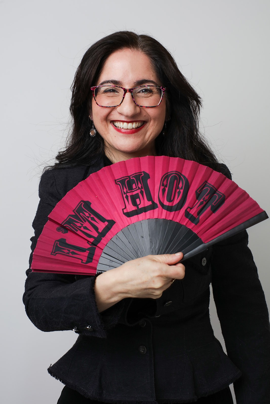 A lady holding a fan