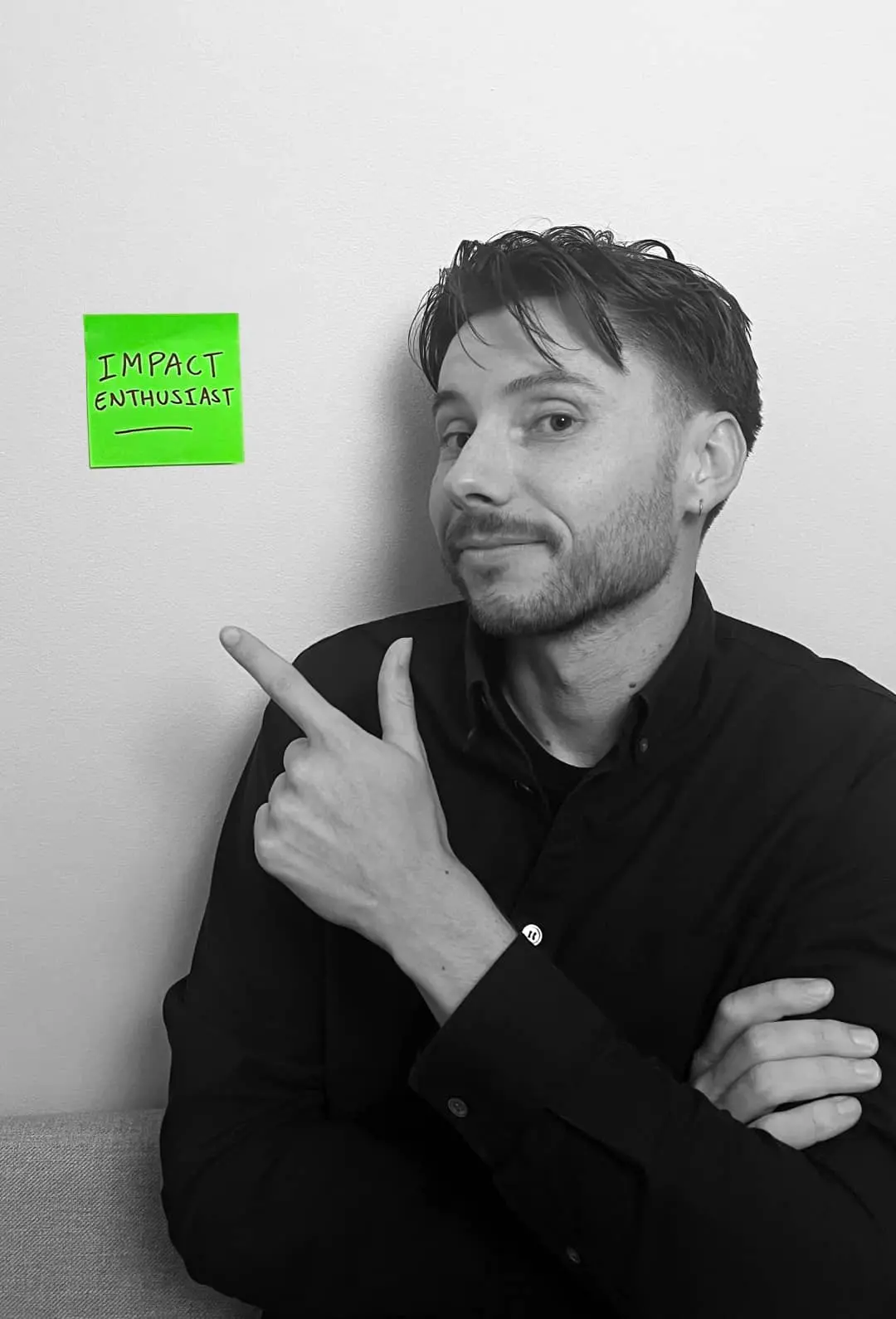 Designer Samuel Marshall pointing at a not that reads Imact Enthusiast