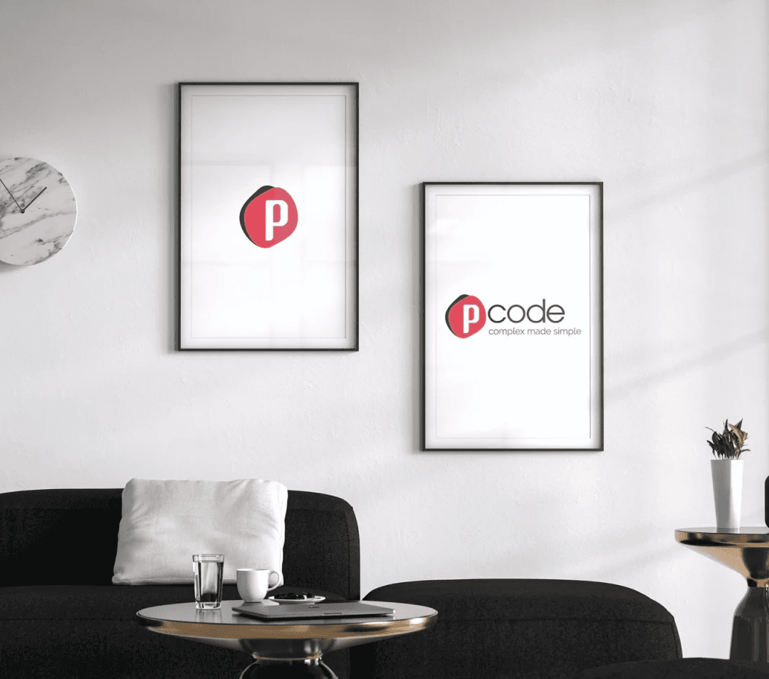 Two framed images of logos hanging on a wall.