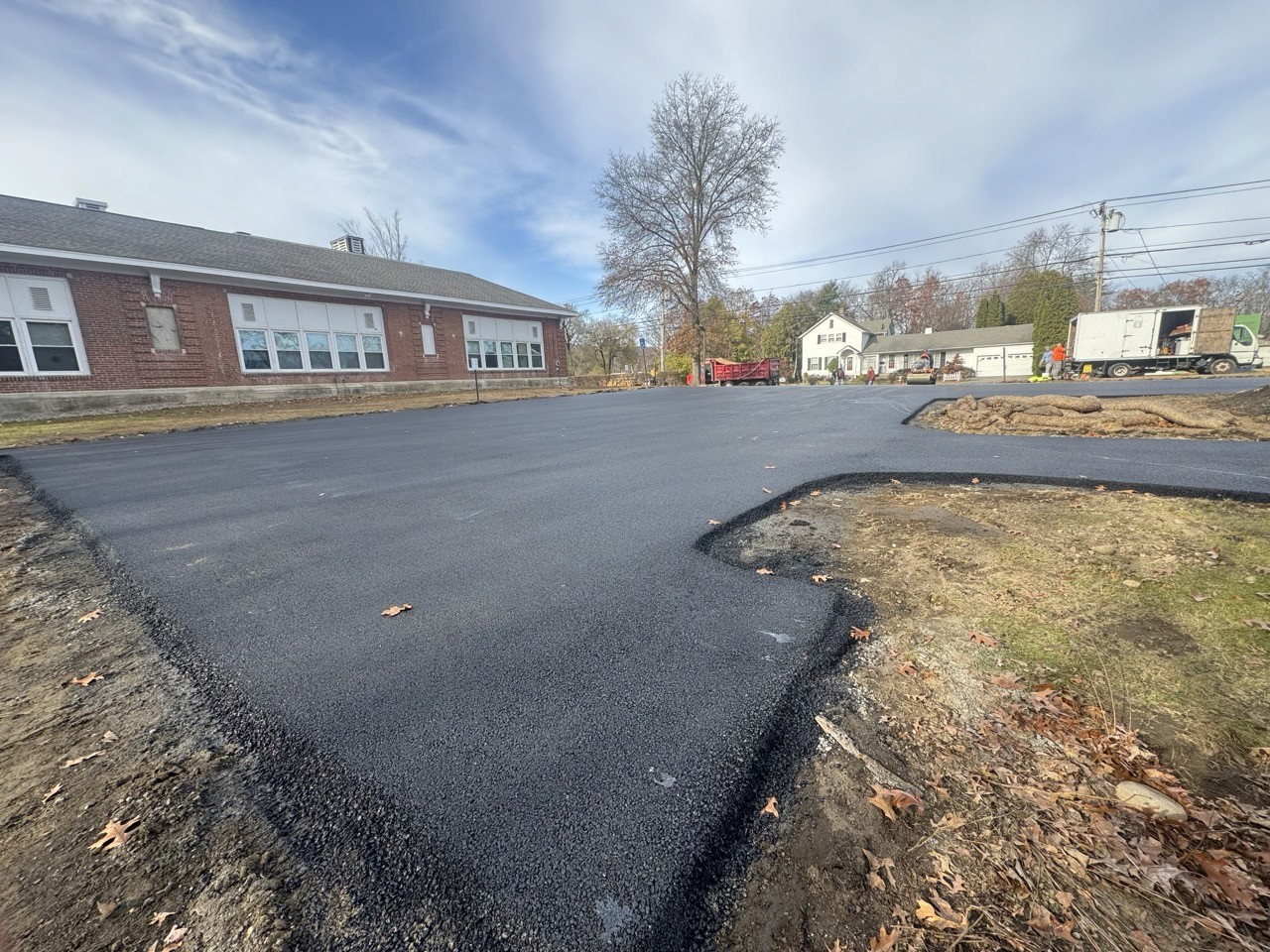 Curved edge of a freshly paved school lot, by A&M Construction Enterprises