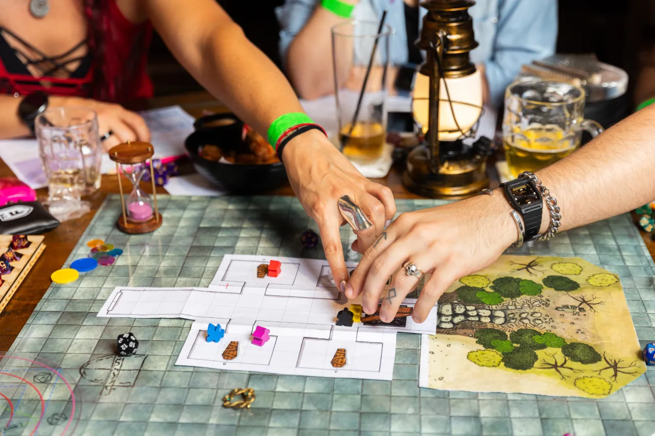 Close up picture of hands playing a board game