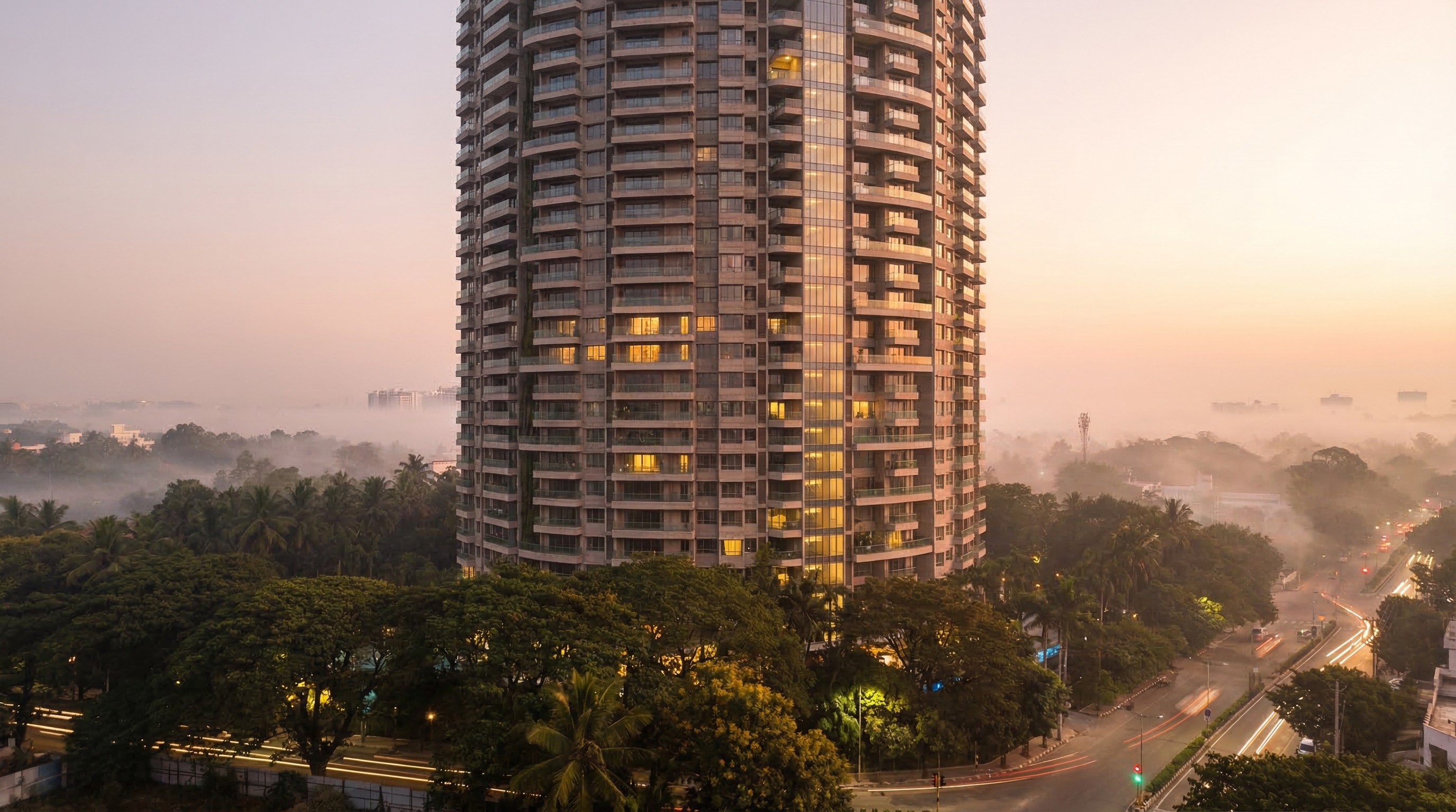 Upscale in-tower fine dining restaurant at Prestige Vaishnaoi Rainbow Waters with floor-to-ceiling glass windows overlooking the Gachibowli skyline at night