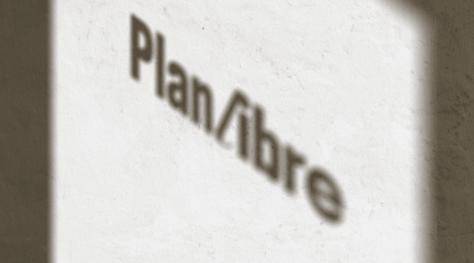 A person in business attire lies amidst scattered papers and folders on a red carpet, holding a phone receiver. The scene conveys chaos and stress.