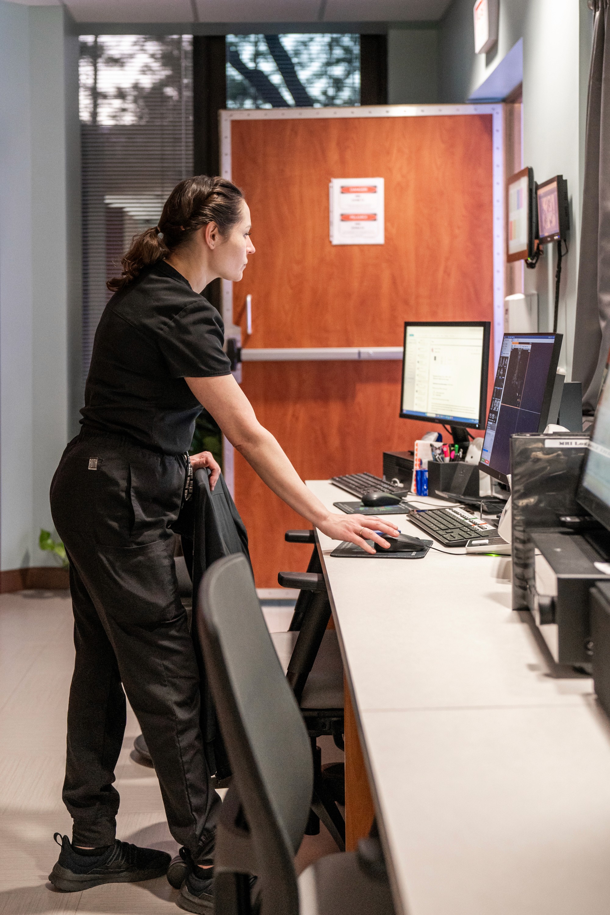 Tether Supervision mobile contrast unit displaying a live virtual radiologist on a HIPAA-compliant video platform, providing real-time precision guidance and scalable virtual direct supervision for contrast-enhanced CT and MRI in outpatient imaging centers.