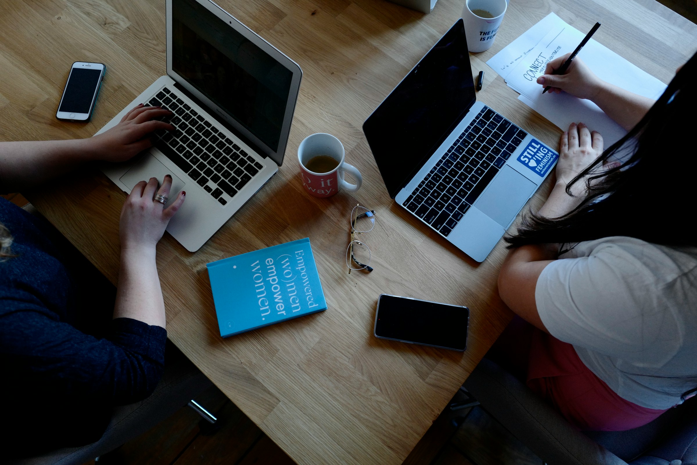 person sitting alone with a team member - Short-Form Content Marketing