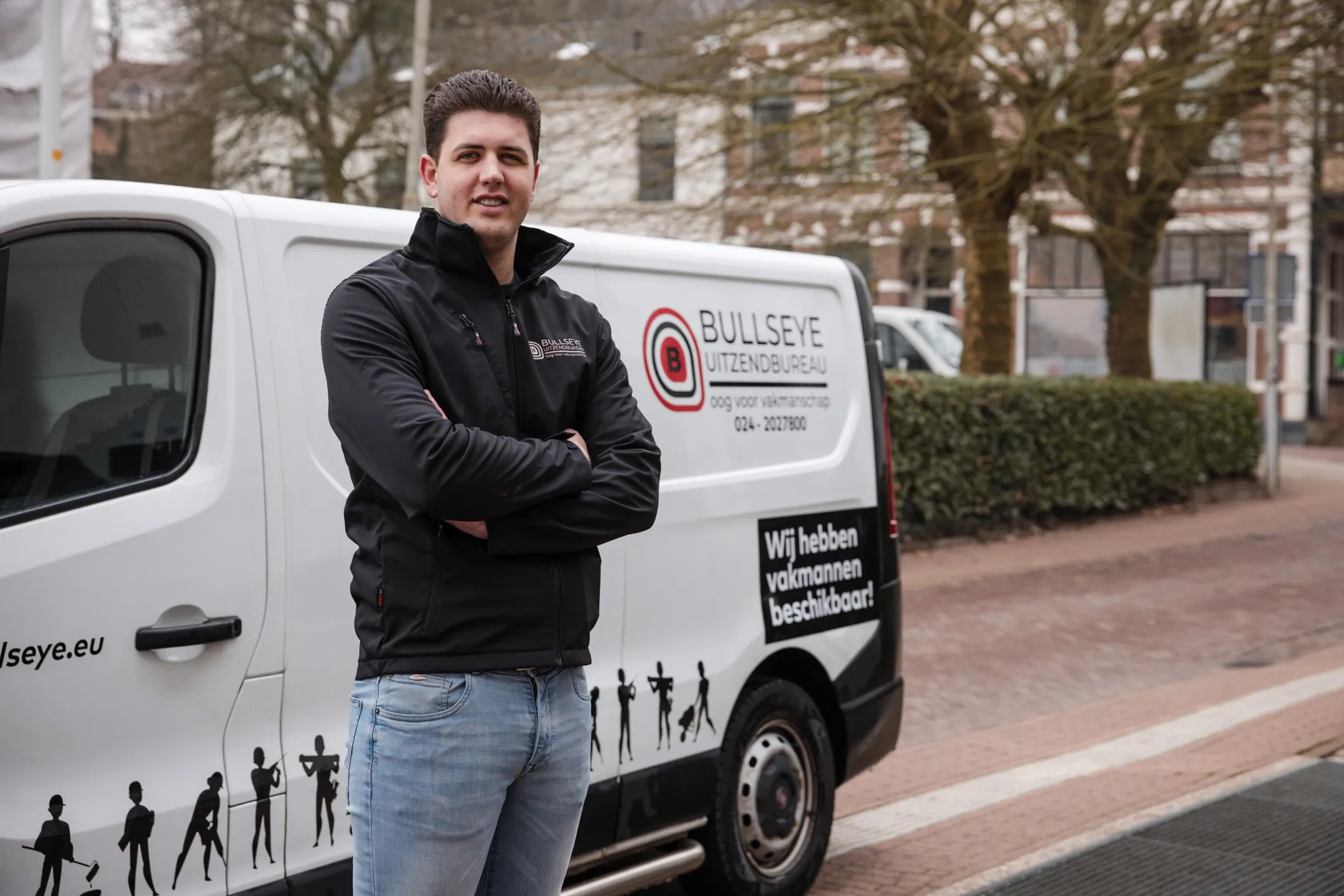 man in green and black plaid long sleeve shirt holding red and black cordless hand drill