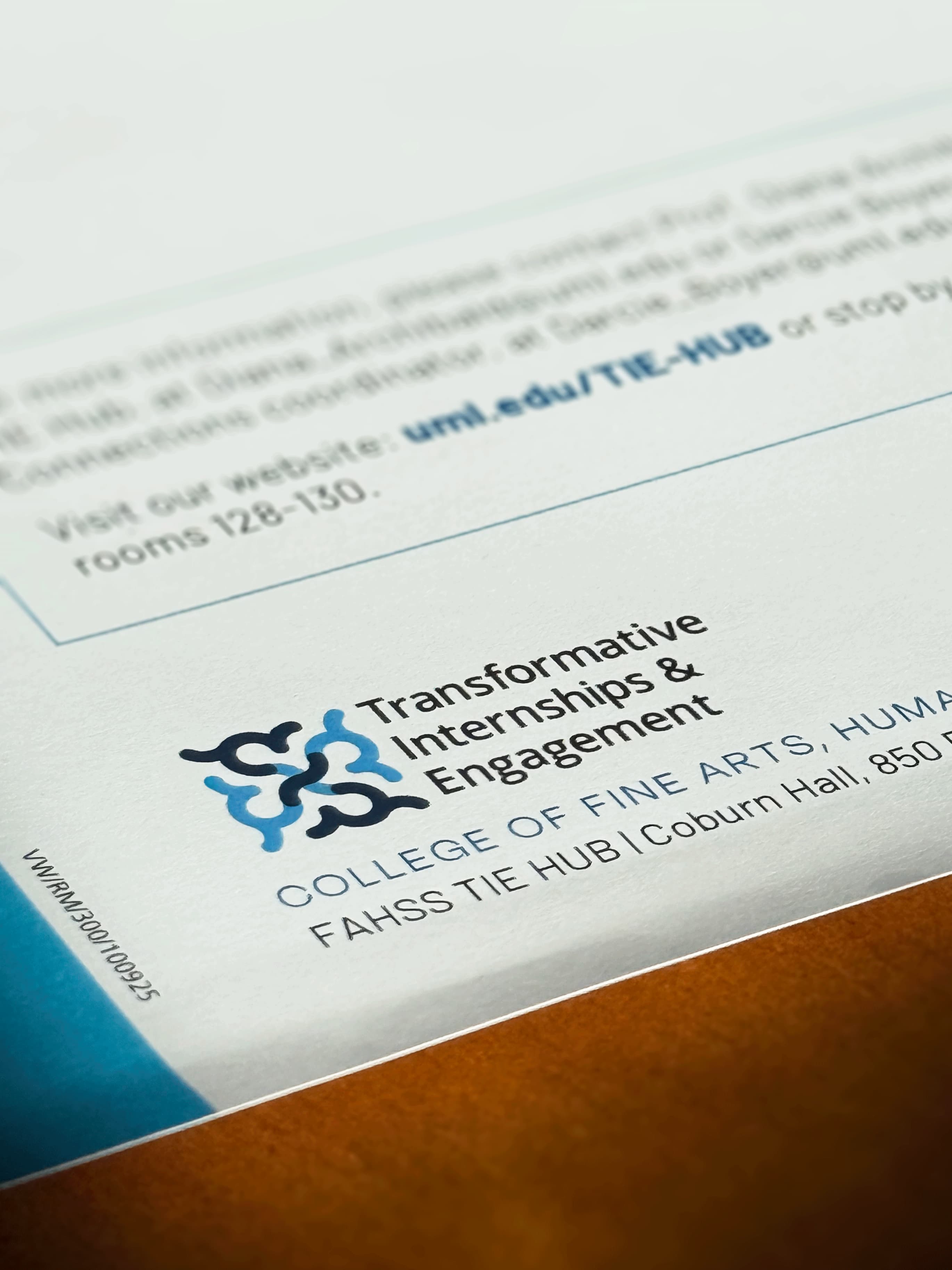 Closer Look to Print Material Showcasing TIE Hub Logo