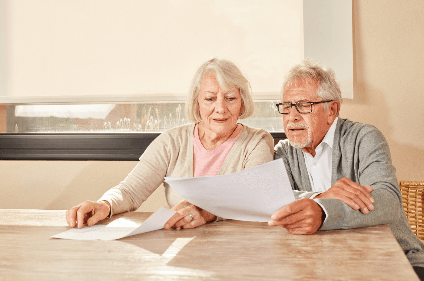 Senior Couple Reading a Document Together 