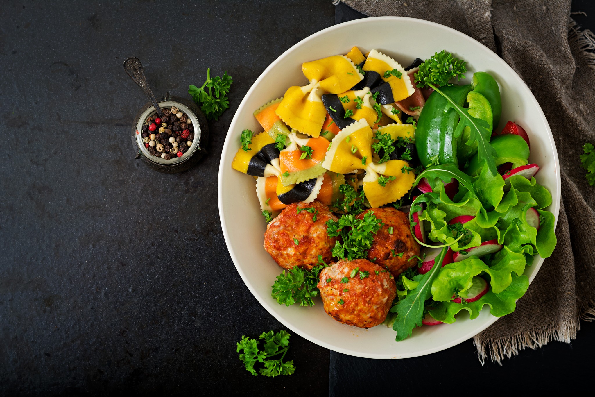 Farfalle pasta with baked meatballs