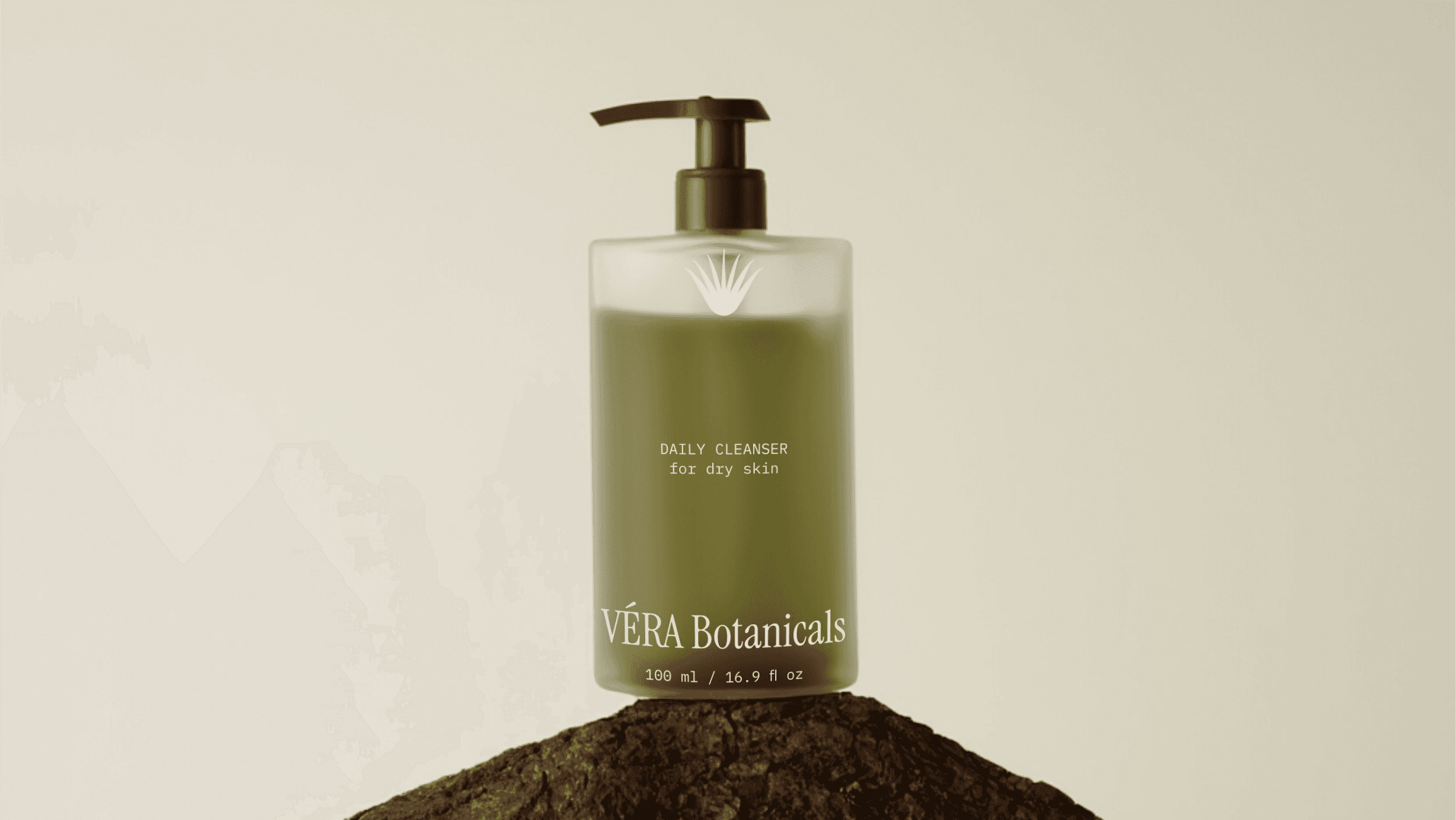 A packaging bottle design for the organic skincare brand VÉRA Botanicals. The bottle has a frosted glass finish and olive-green liquid.