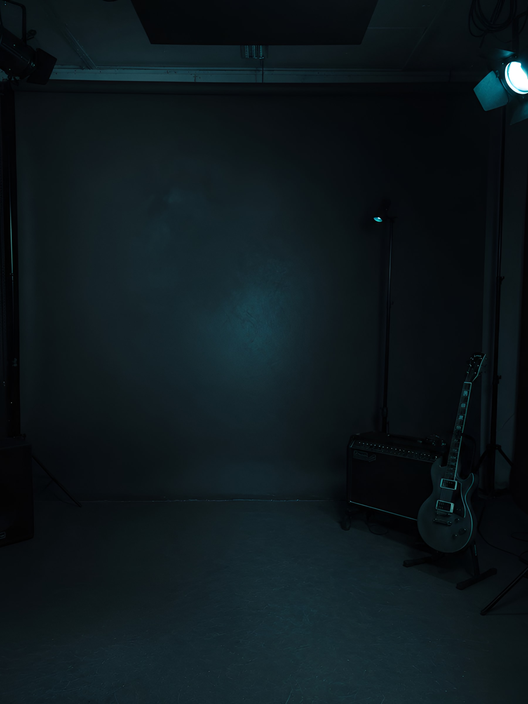 Adrian Klein and LeShaman in a dark studio portrait.