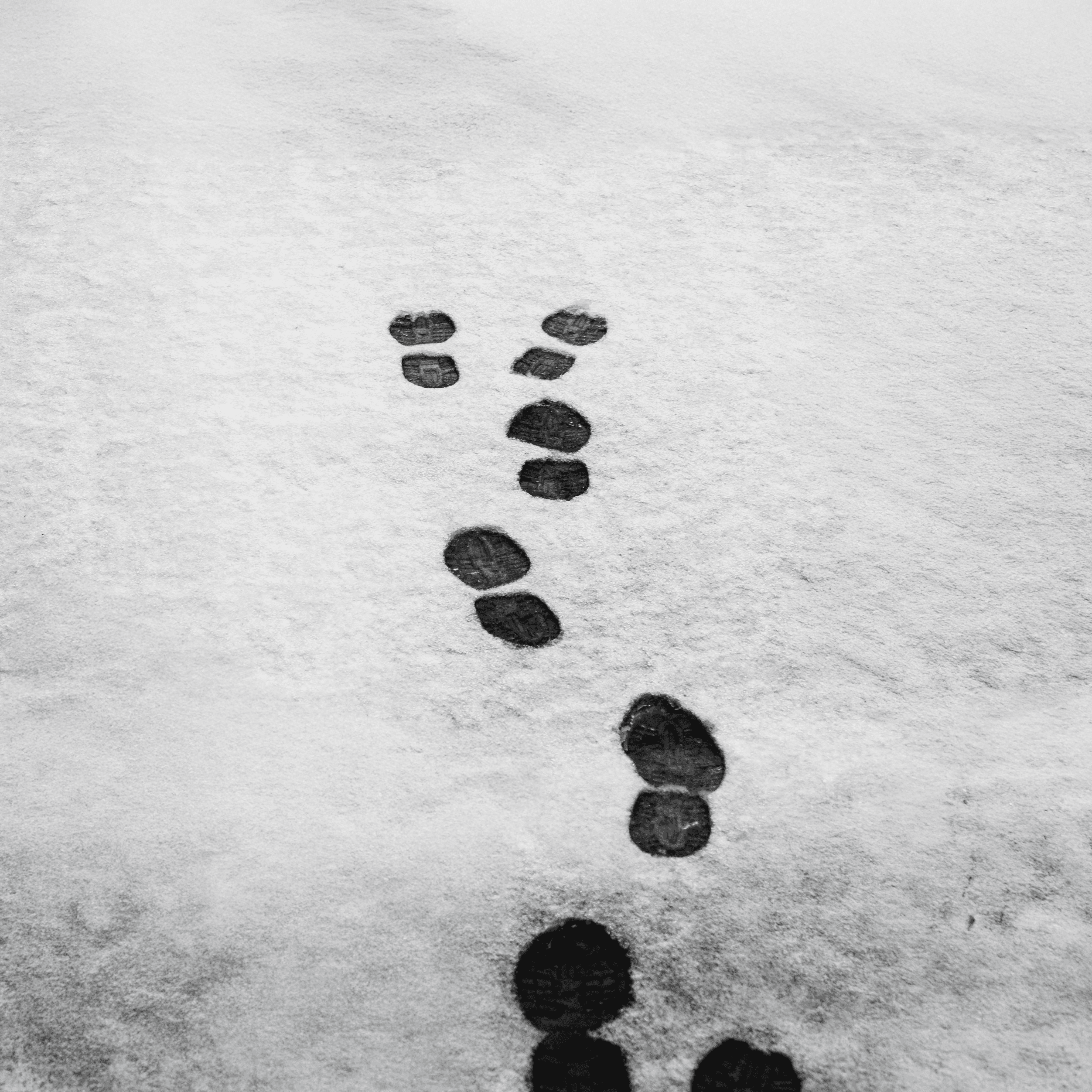 Person sitting on a ledge overlooking New York City skyline