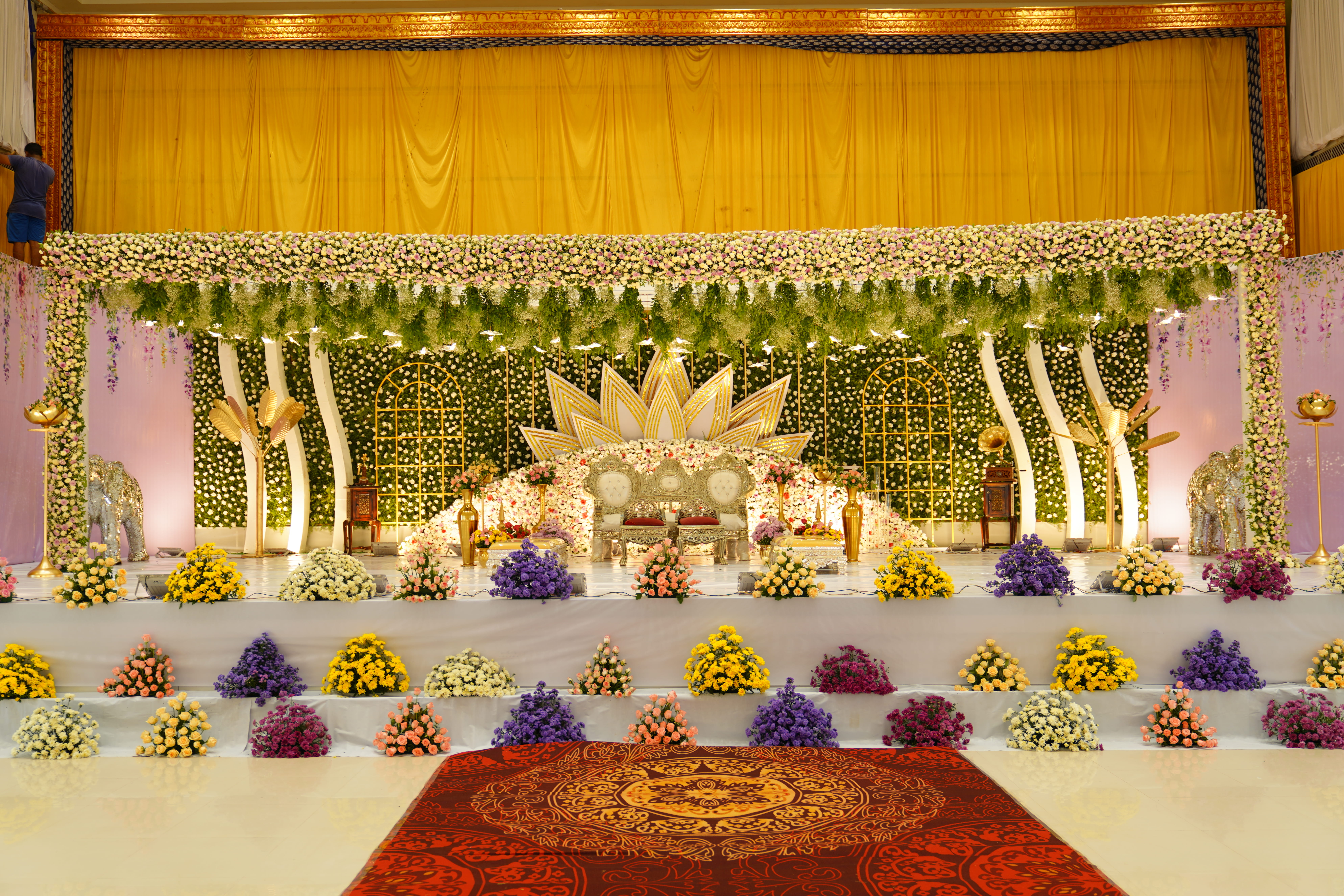 Wedding stage and mandap decor with floral and lighting arrangements, styled and captured by Wow Makers in Hyderabad, India