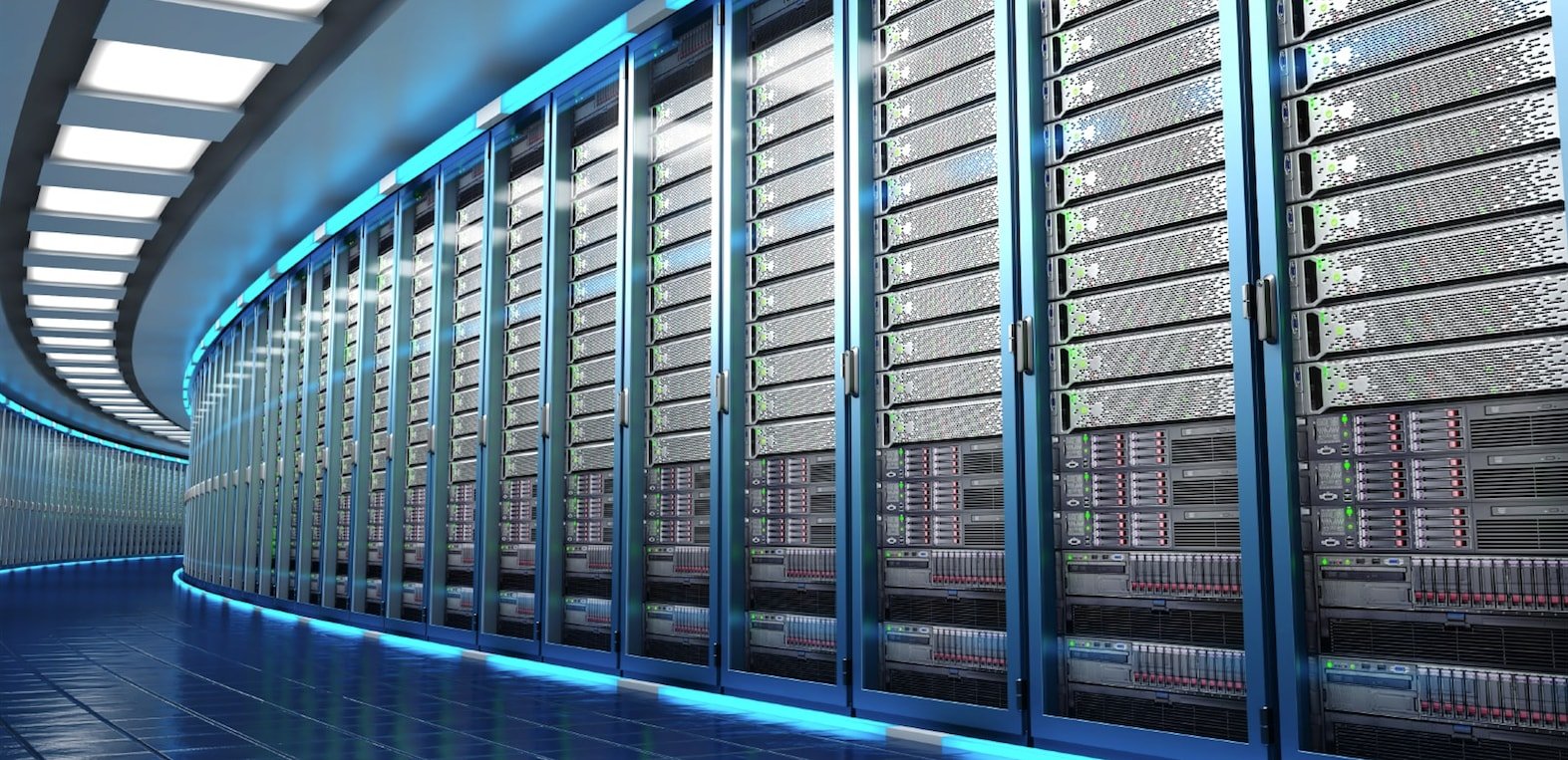 Scoped Work - Three people sit around a table discussing work, with laptops and monitors in a bright, modern office space.