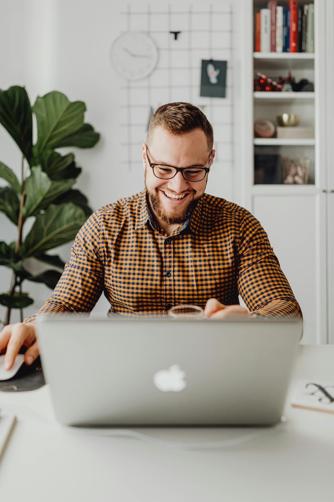A Man Using Laptop while Sitting