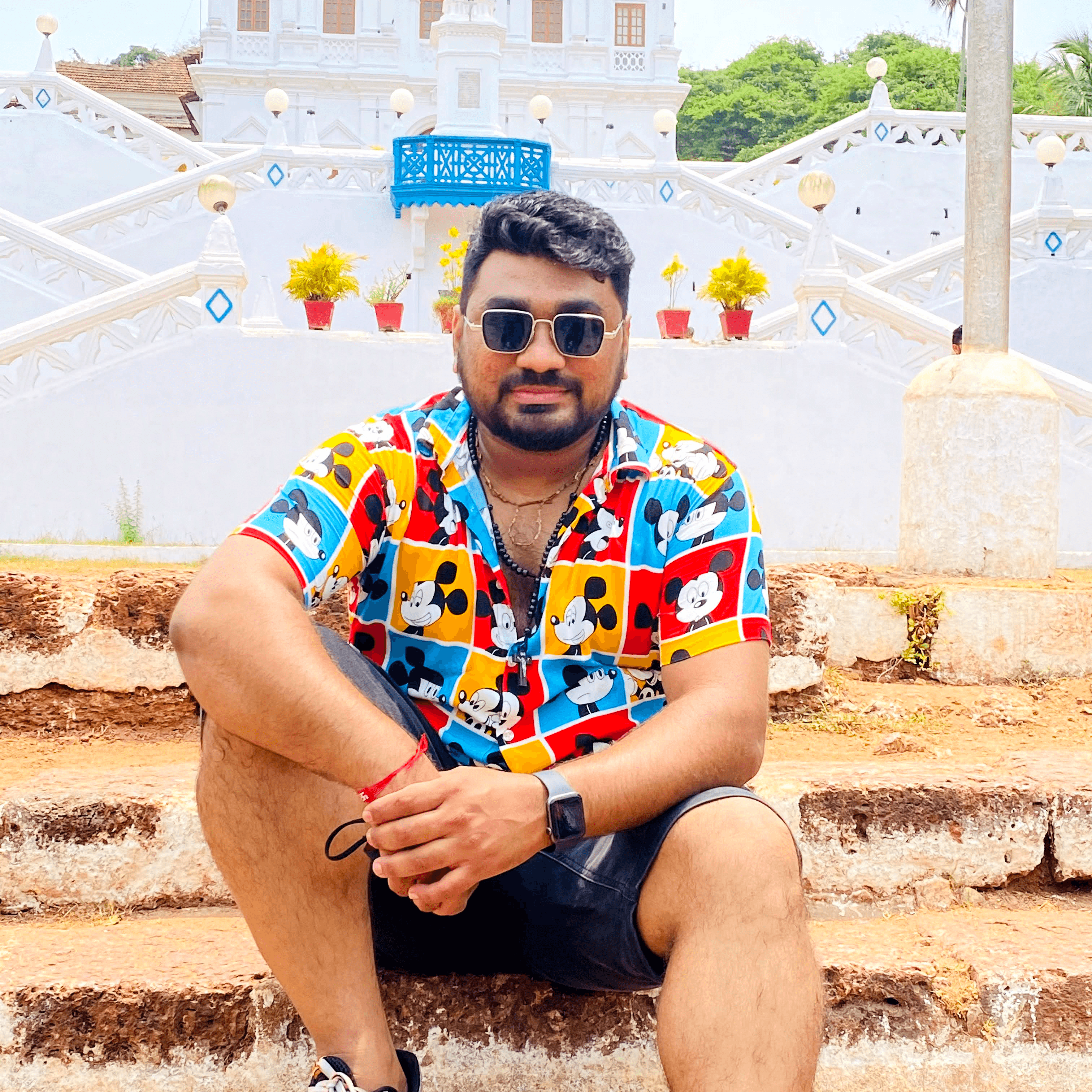 Black and white portrait of a man with a beard and glasses