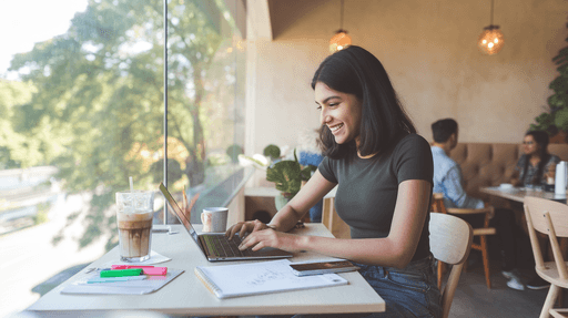 Woman filing her taxes on a laptop, with income sources and a confirmation of successful e-filing.