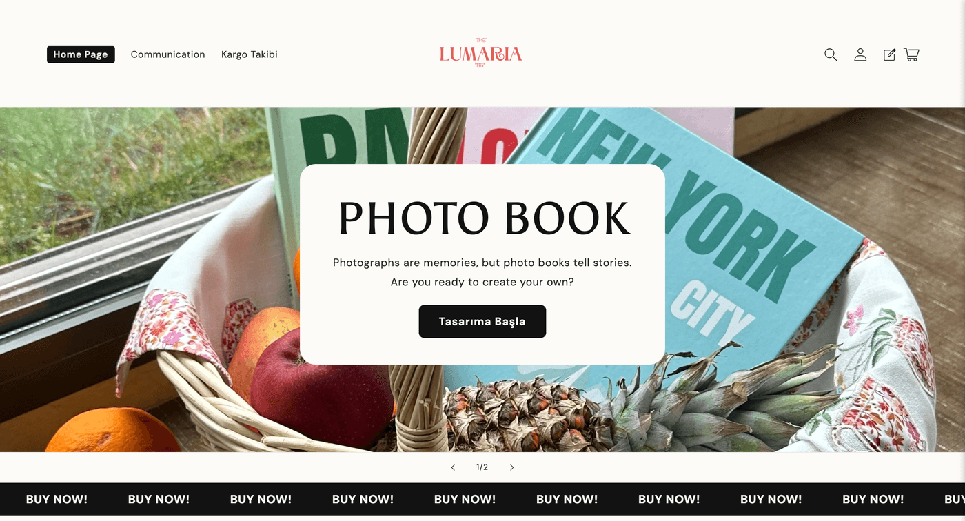The Lumaria homepage, showing their photo book hero section