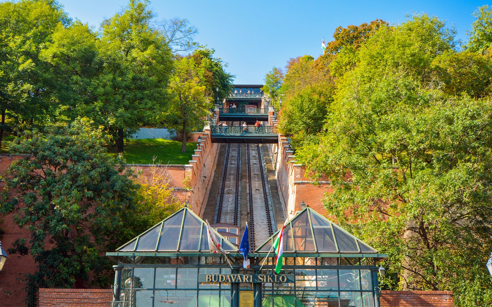 Budapest Castle Hill Funicular with city view and Danube River in background.