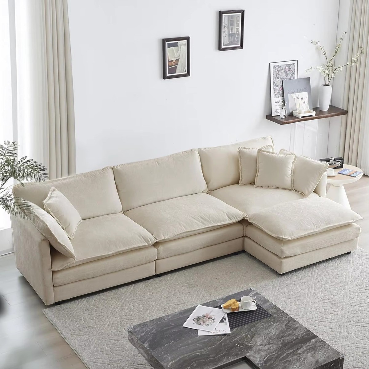 Modern L-Shaped Chenille Cloud Couch with Ottoman in a cozy living room featuring a marble coffee table & light decor