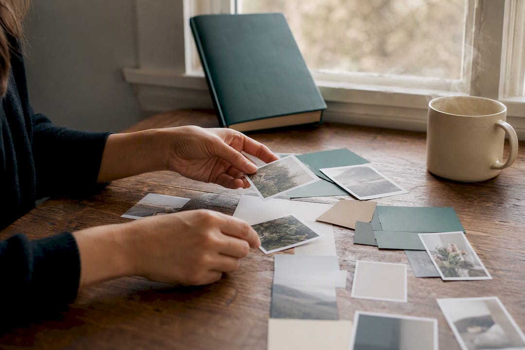 Hands arranging content pieces on desk