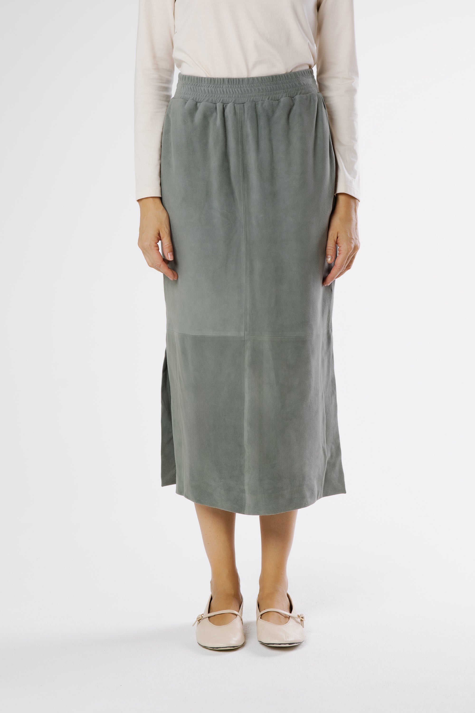 Front view of konbu green suede midi skirt with elastic waistband and clean straight silhouette