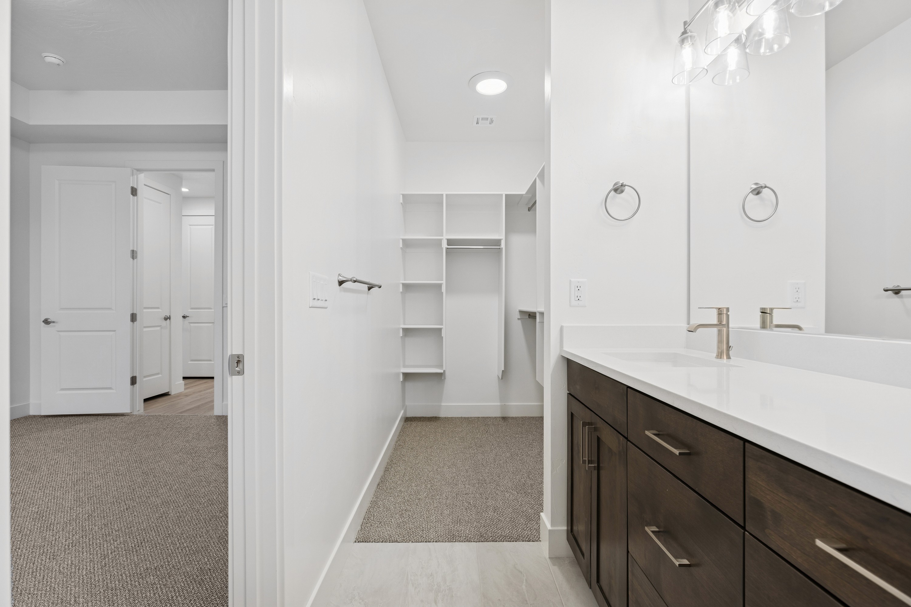 Master bedroom in The High Desert Home with walk-in closet and bright, airy space in Hurricane Utah.