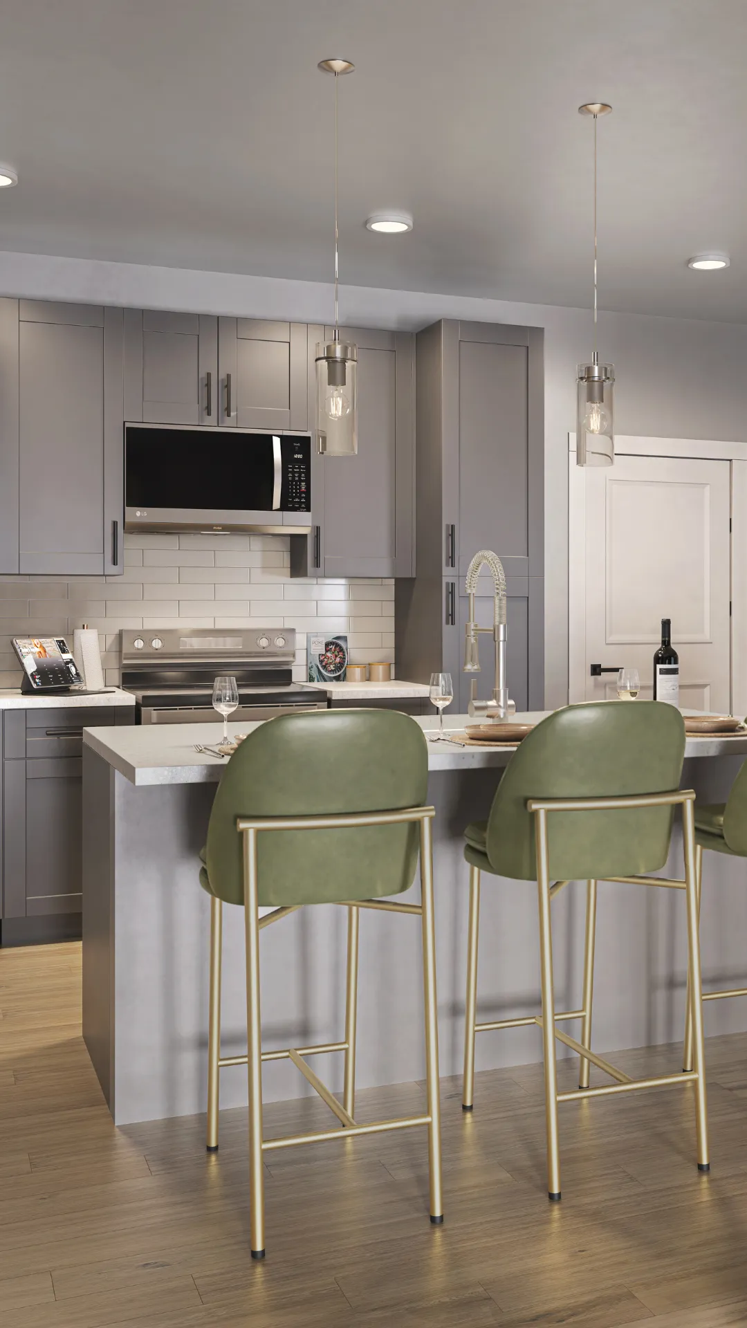 A modern kitchen featuring a bar with stools, creating a casual dining space.