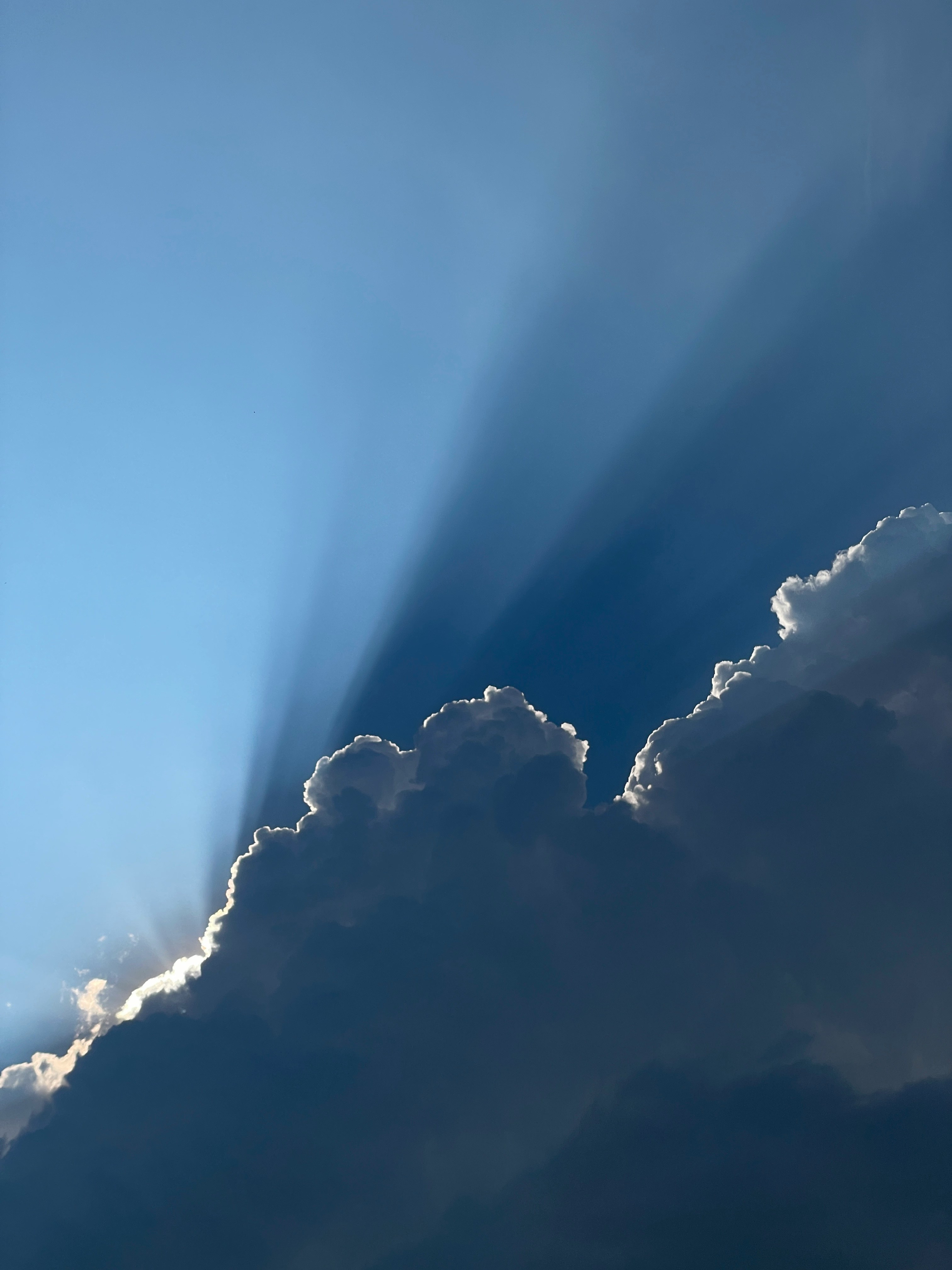 the sun is shining through the clouds in the sky