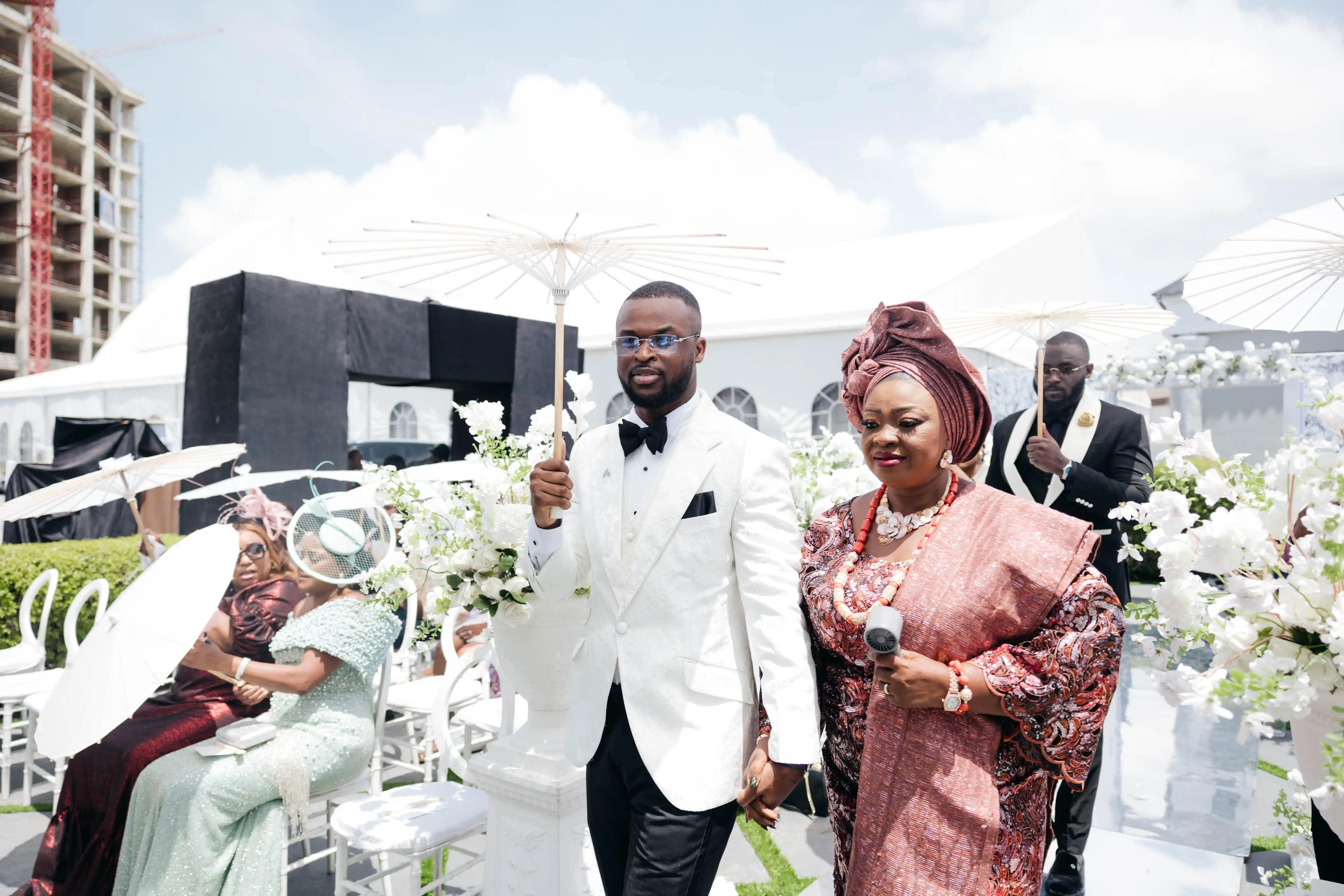 Bride and groom celebrating a luxury wedding coordinated by Victoria Brooks Events, a premium wedding planner in Nigeria.