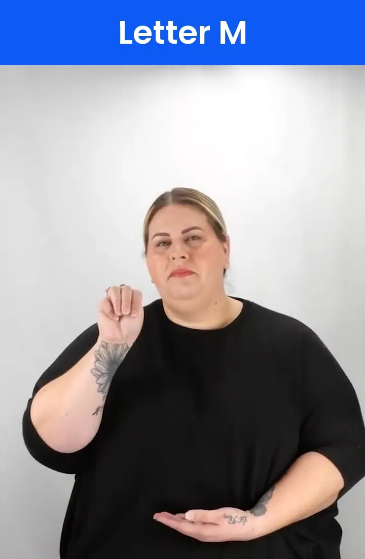 A Deaf signer signs M in ASL