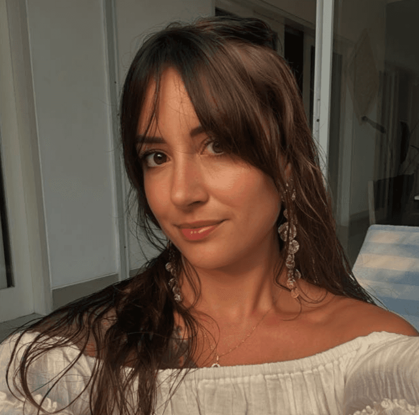 selective focus photography of woman wearing black off-shoulder blouse