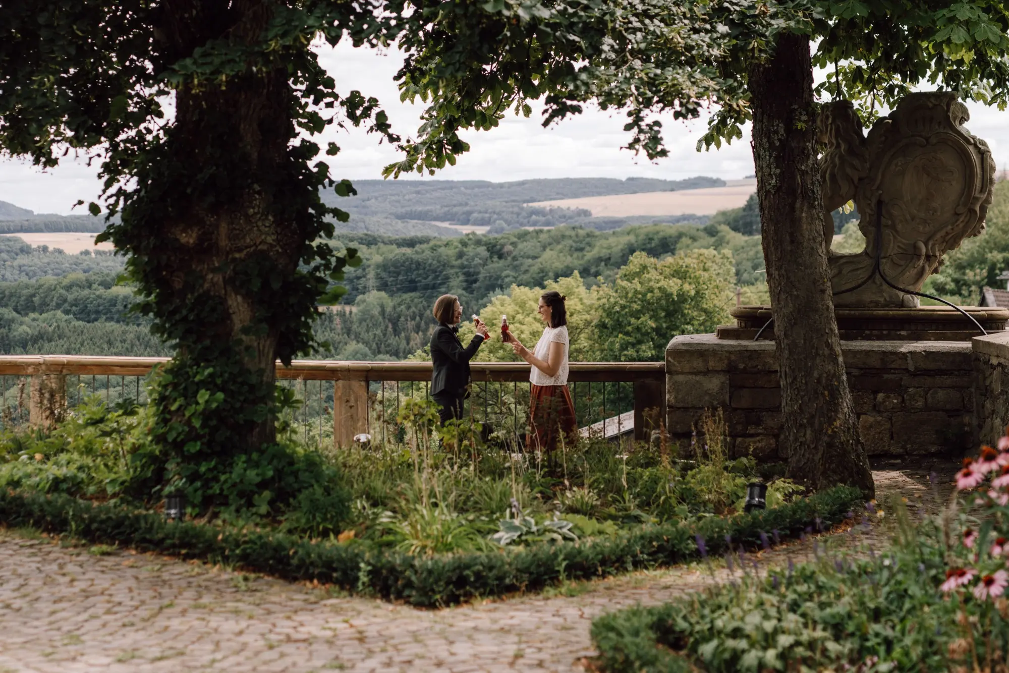 Intimate first look between two grooms in the forest – LGBTQ+ Wedding Photography by Eva Sitko